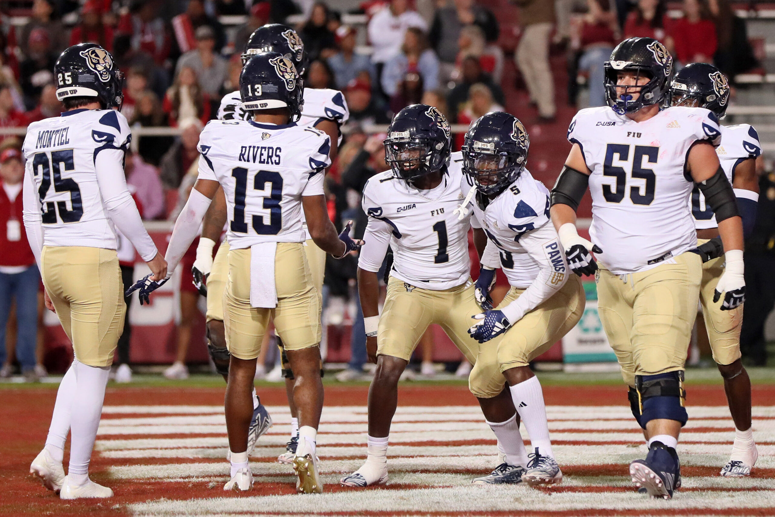Nov 18, 2023; Fayetteville, Arkansas, USA; FIU Panthers quarterback Keyone Jenkins (1) celebrates after scoring a touchdown in the first quarter against the Arkansas Razorbacks at Donald W. Reynolds Razorback Stadium. Mandatory Credit: Nelson Chenault-Imagn Images