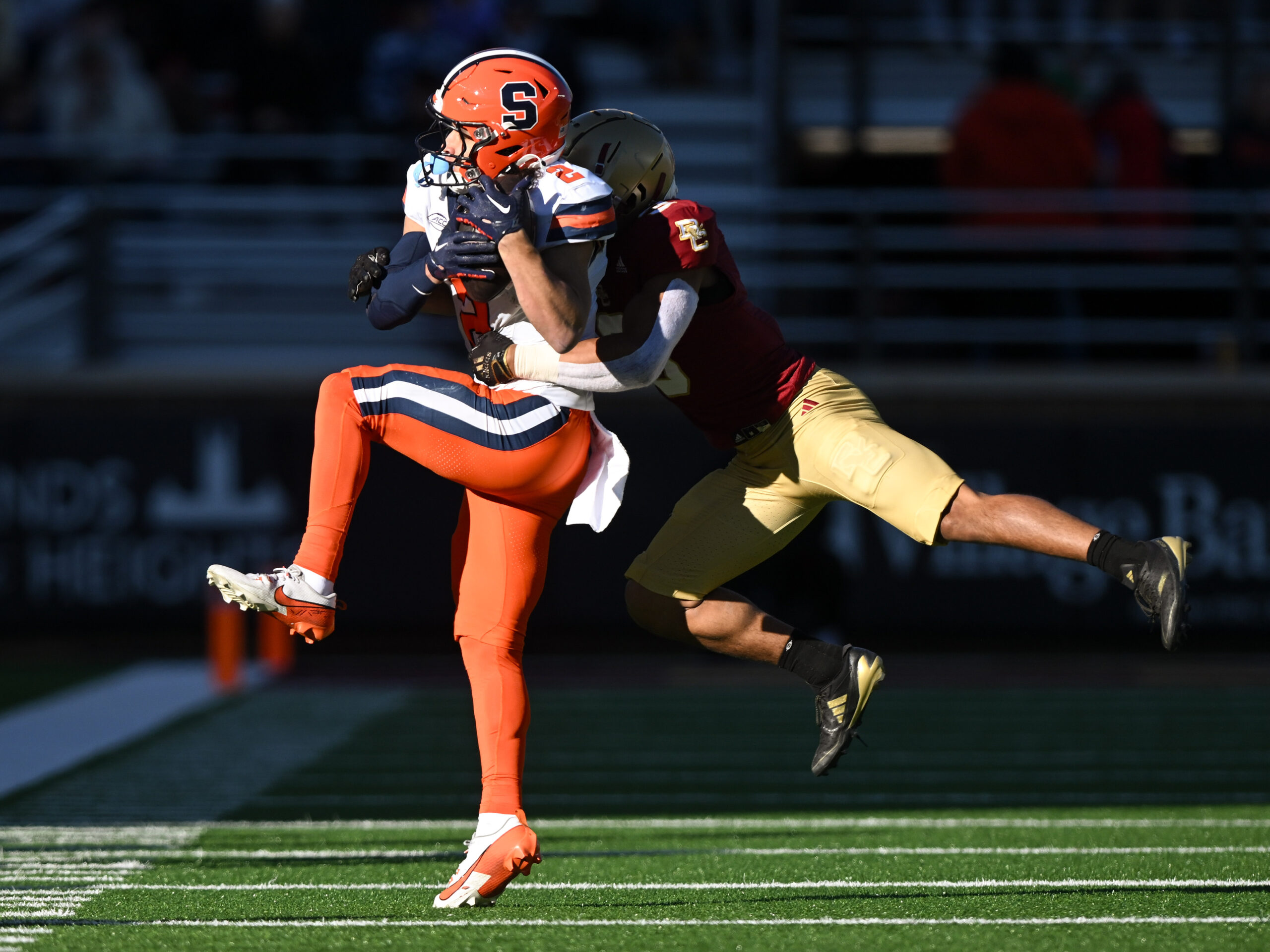 Nov 9, 2024; Chestnut Hill, Massachusetts, USA; Syracuse Orange wide receiver Trebor Pena (2) makes a catch in front of Boston College Eagles defensive back Khari Johnson (3) during the second half at Alumni Stadium. Mandatory Credit: Brian Fluharty-Imagn Images