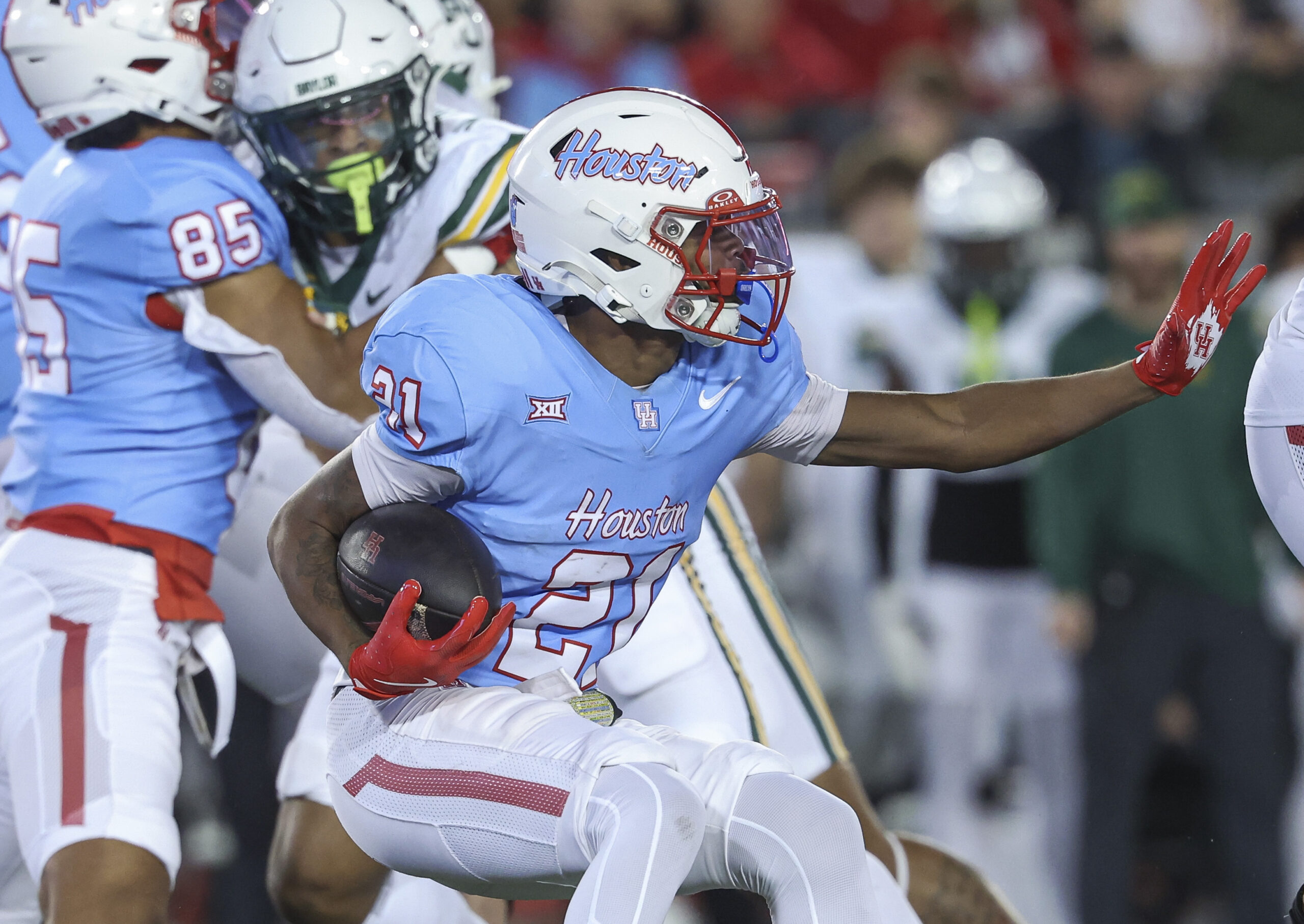 Nov 23, 2024; Houston, Texas, USA; Houston Cougars running back Stacy Sneed (21) runs with the ball during the second quarter against the Baylor Bears at TDECU Stadium. Mandatory Credit: Troy Taormina-Imagn Images