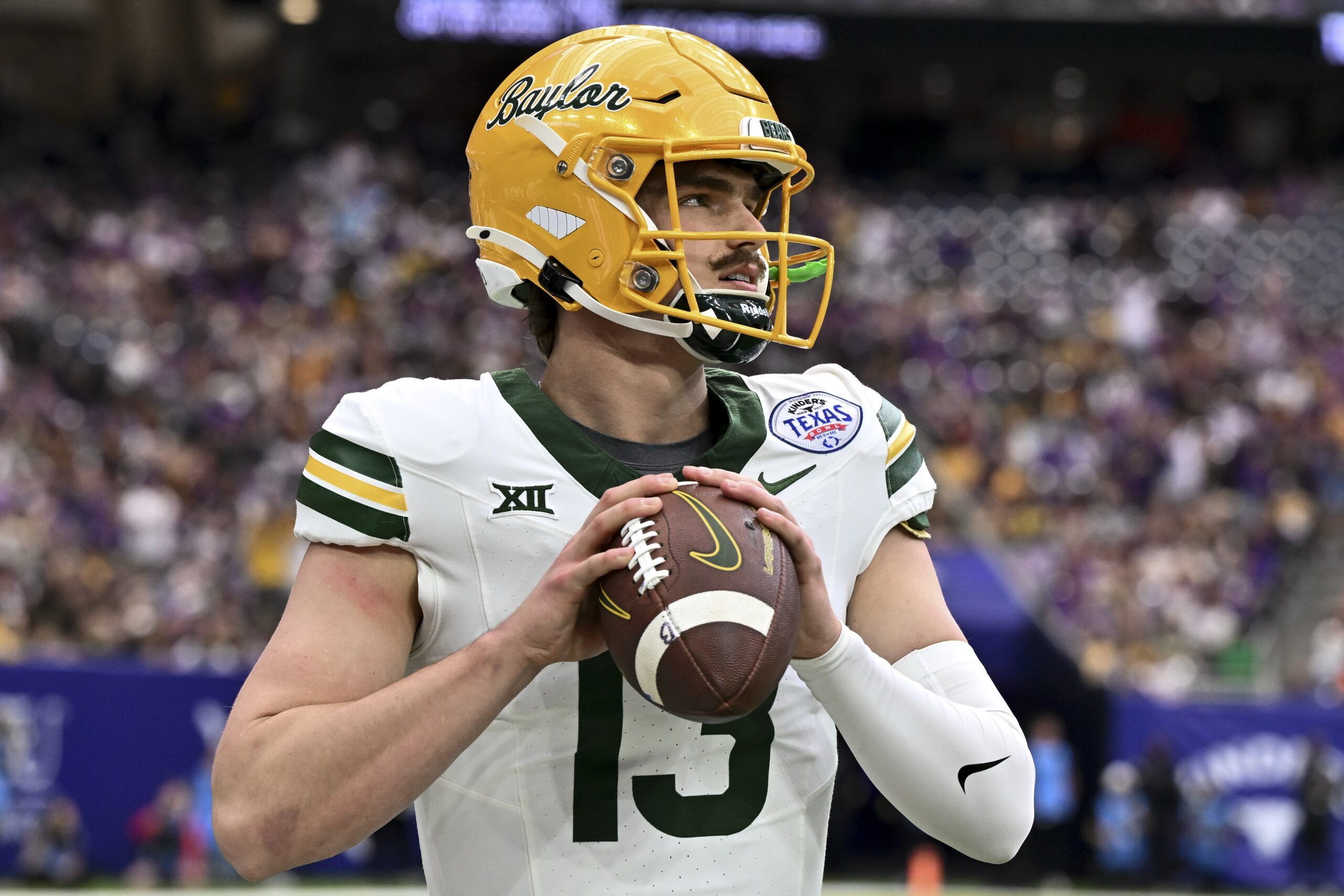 Dec 31, 2024; Houston, TX, USA; Baylor Bears quarterback Sawyer Robertson (13) warms up on the sideline during the first half against the LSU Tigers at NRG Stadium. Mandatory Credit: Maria Lysaker-Imagn Images