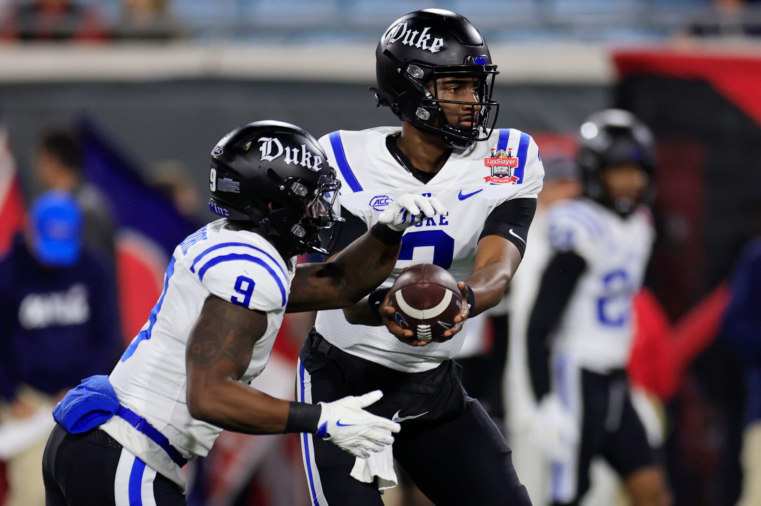 (EDITORÕS NOTE: Resubmitted with alternate crop.) Duke Blue Devils quarterback Henry Belin IV (3) hands off to running back Jaquez Moore (9) before the TaxSlayer Gator Bowl Thursday, Jan. 2, 2025 at EverBank Stadium in Jacksonville, Fla. [Corey Perrine/Florida Times-Union]