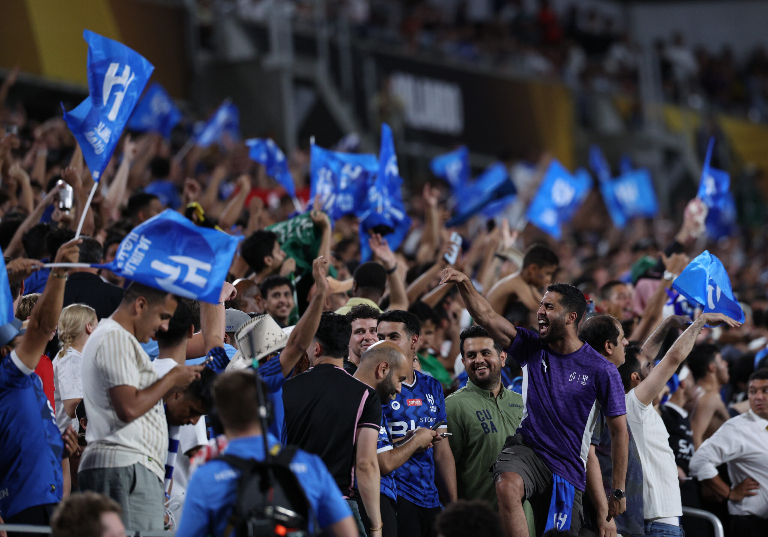 Jun 30, 2025; Orlando, Florida, USA; Al Hilal FC fans react in extra time against Manchester City during a round of 16 match of the 2025 FIFA Club World Cup at Camping World Stadium. Mandatory Credit: Nathan Ray Seebeck-Imagn Images