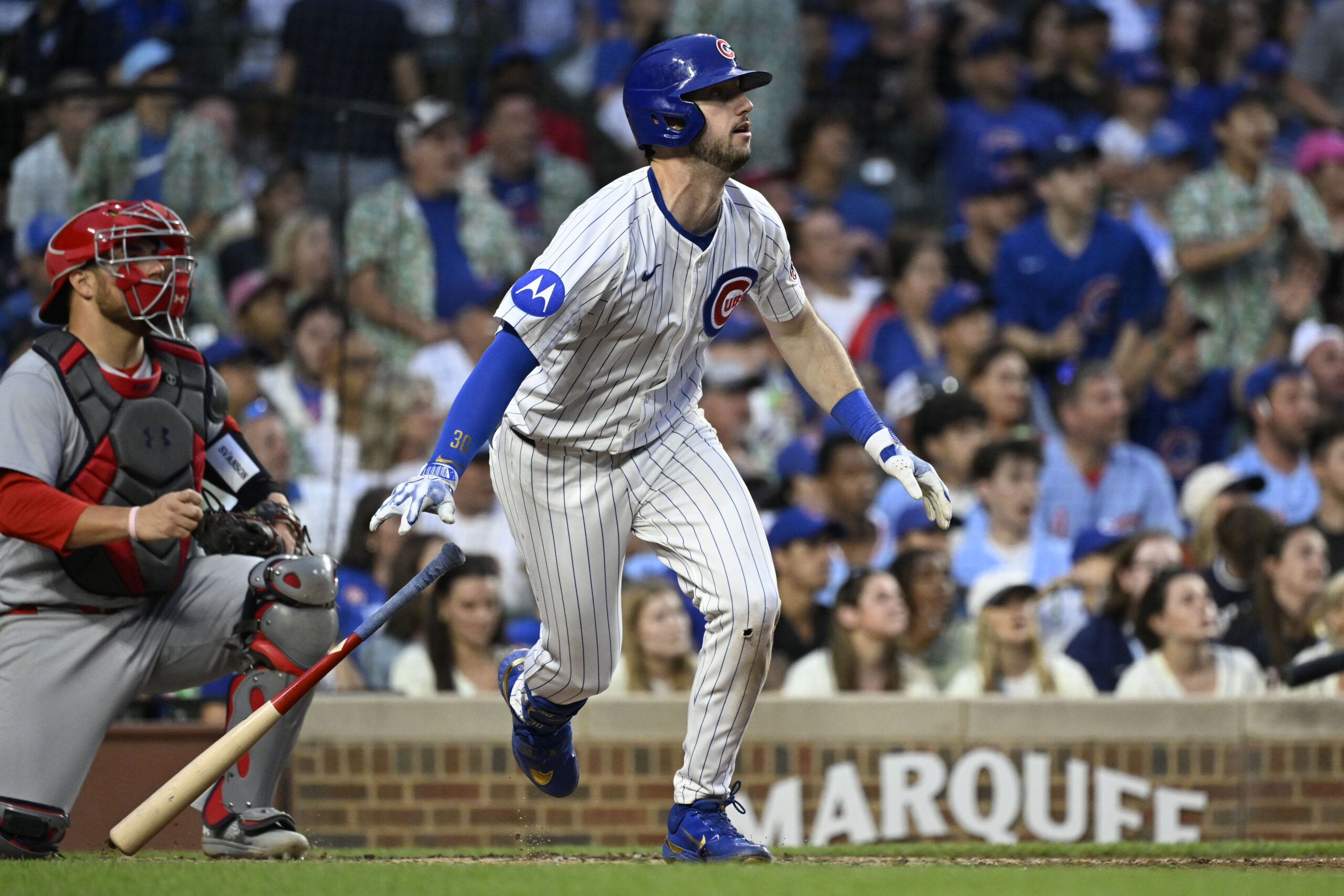 Jul 6, 2025; Chicago, Illinois, USA; Chicago Cubs outfielder Kyle Tucker (30) hits an RBI sacrifice fly ball during the third inning against the St. Louis Cardinals at Wrigley Field. Mandatory Credit: Matt Marton-Imagn Images