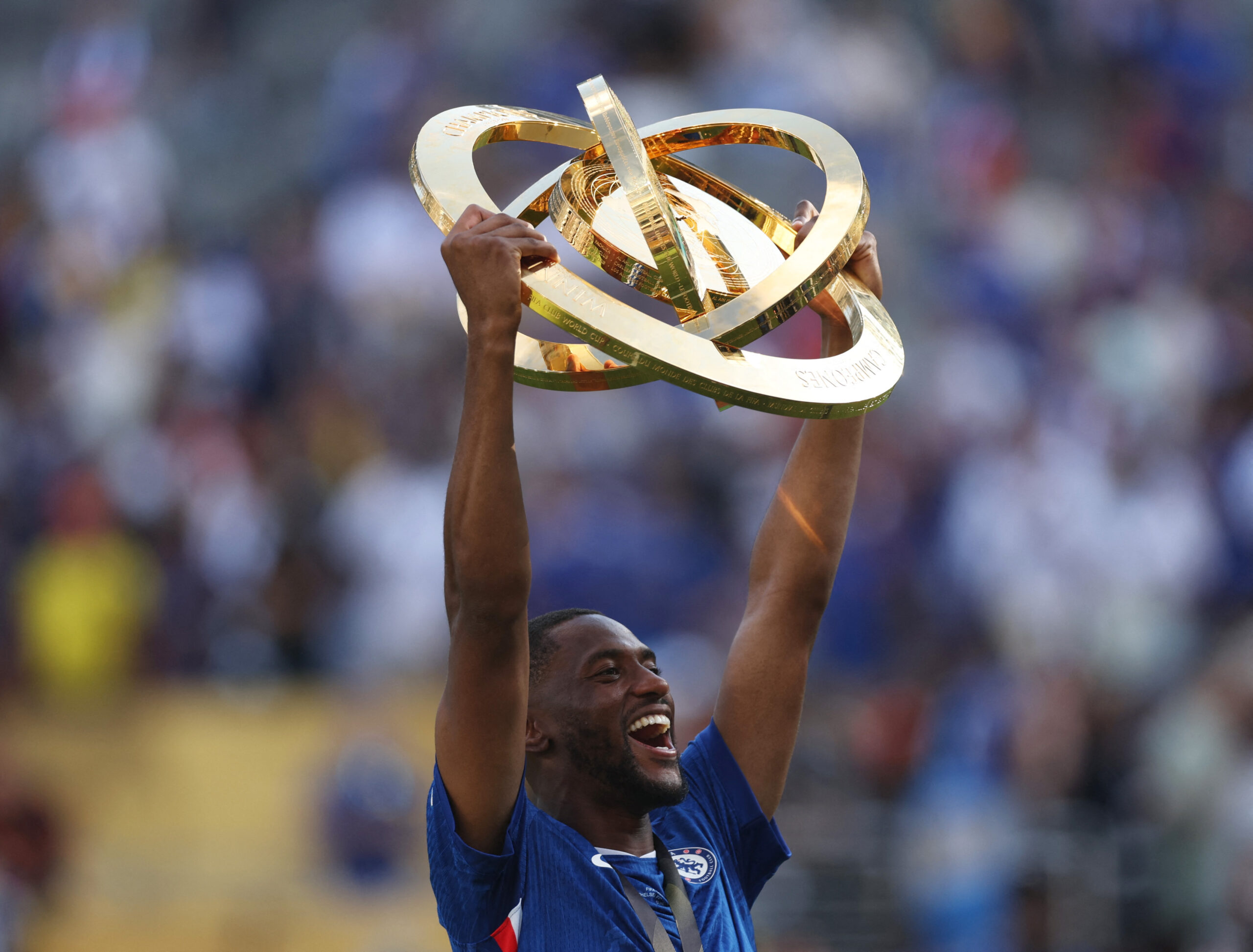 [Subscription Customers Only] Jul 13, 2025; East Rutherford, New Jersey, USA; Chelsea FC defender Tosin Adarabioyo (4) celebrates with the trophy after winning the final of the 2025 FIFA Club World Cup at MetLife Stadium. Mandatory Credit: Lee Smith-Reuters via Imagn Images