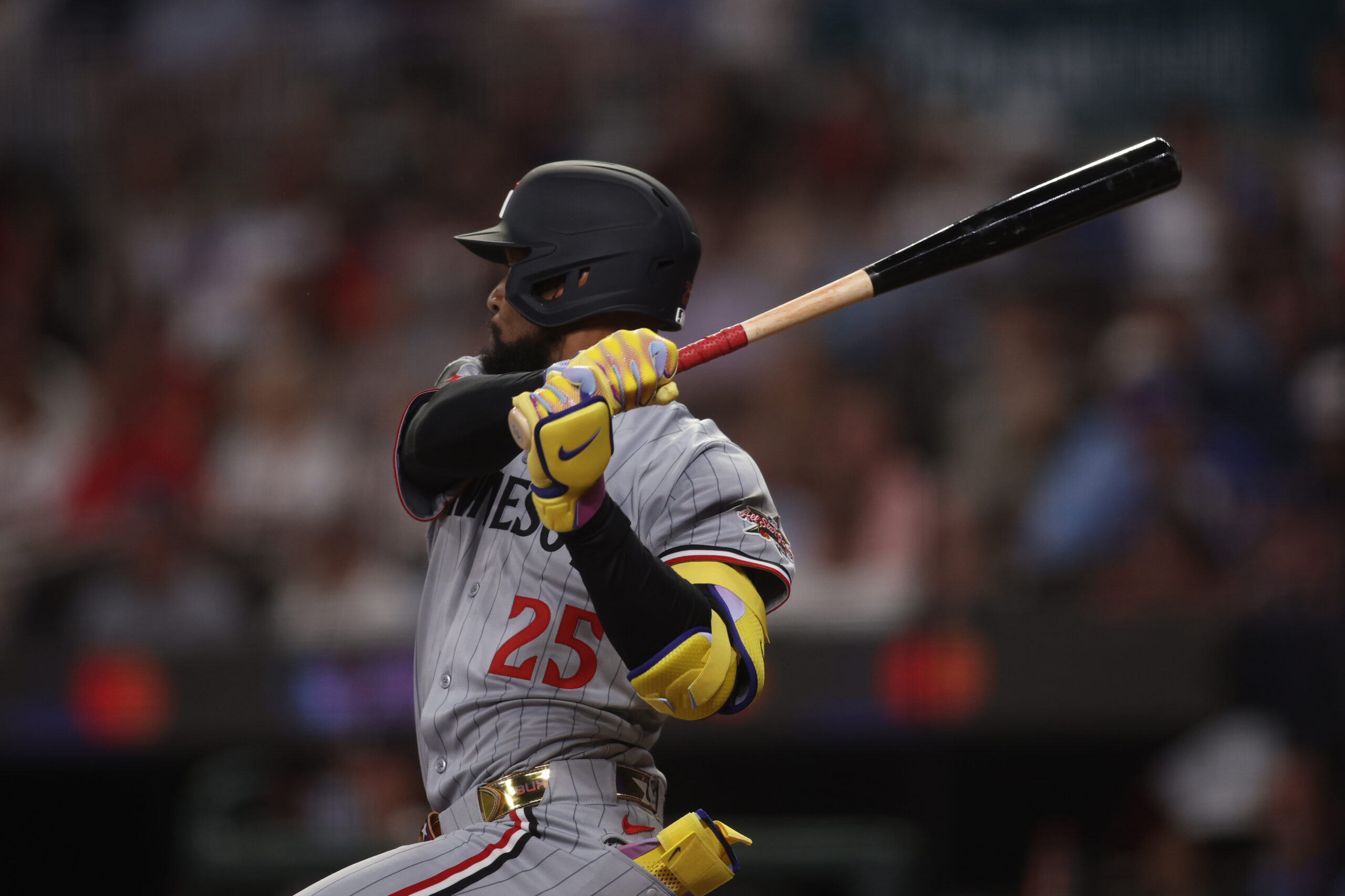 Jul 15, 2025; Cumberland, Georgia, USA; American League outfielder Byron Buxton (25) of the Minnesota Twins hits a double in the ninth inning during the 2025 MLB All Star Game at Truist Park. Mandatory Credit: Brett Davis-Imagn Images