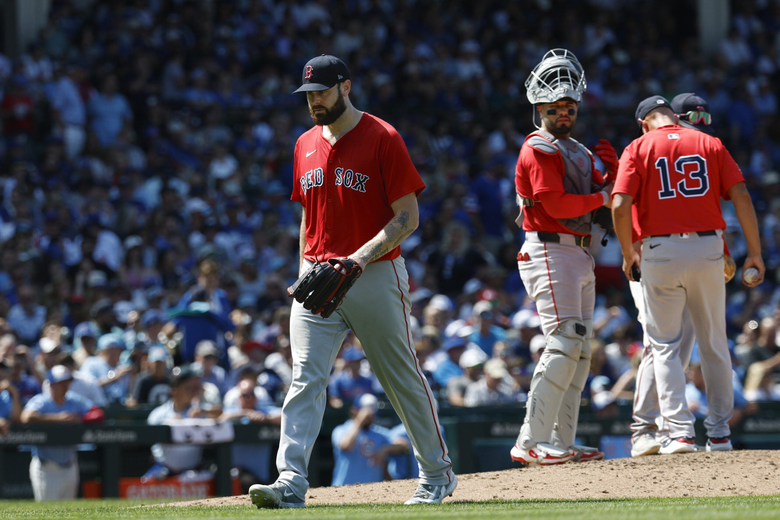 Jul 18, 2025; Chicago, Illinois, USA; Boston Red Sox starting pitcher Lucas Giolito (54) leaves a baseball game against the Chicago Cubs during the sixth inning at Wrigley Field. Mandatory Credit: Kamil Krzaczynski-Imagn Images
