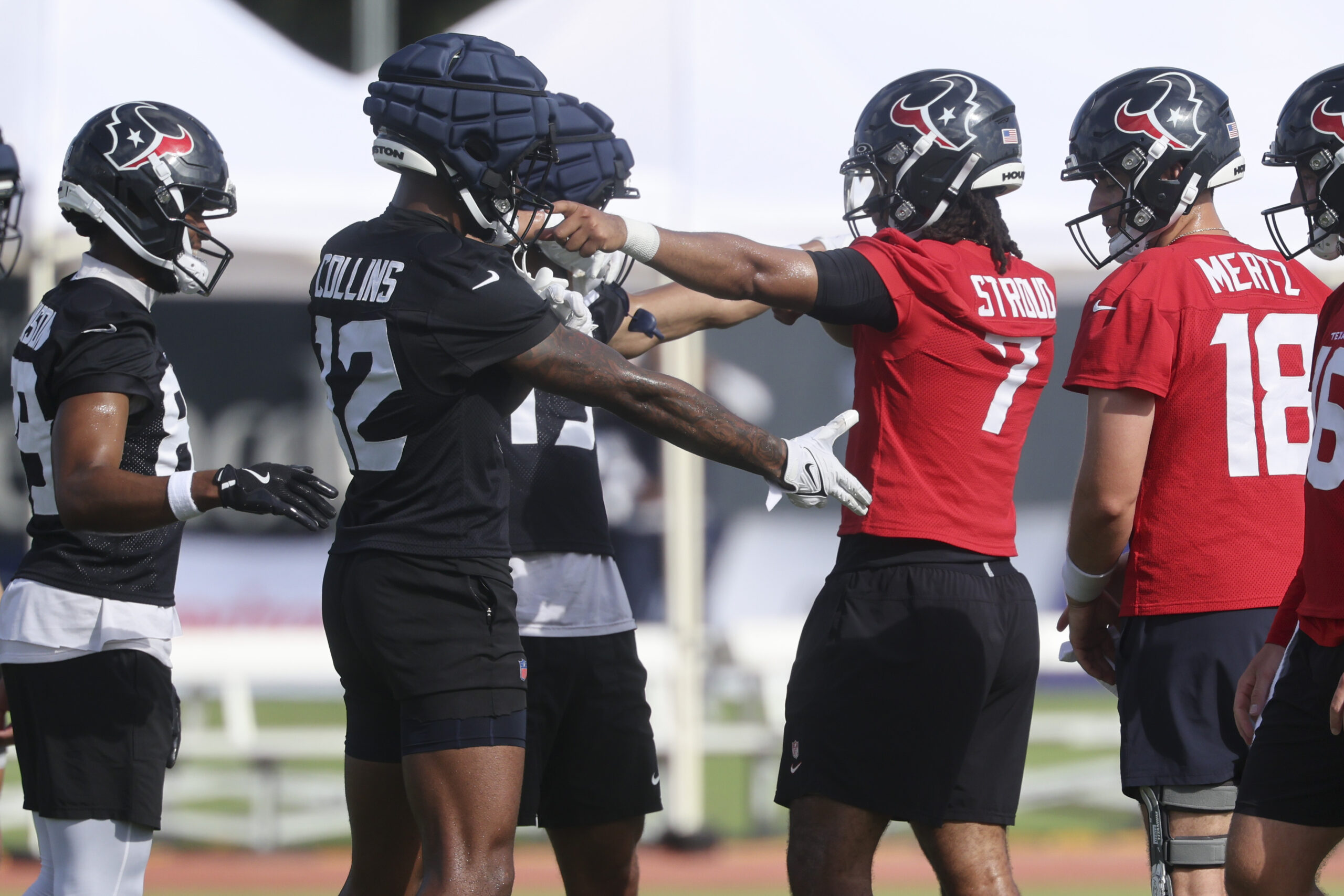 Jul 24, 2025; Houston, TX, USA; Houston Texans wide receiver Nico Collins (12) and quarterback C.J. Stroud (7) during training camp at Houston Methodist Training Center. Mandatory Credit: Troy Taormina-Imagn Images