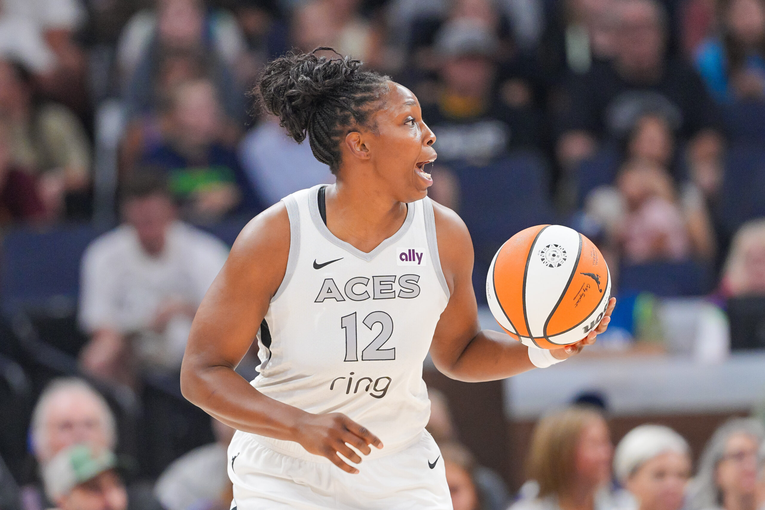 Jul 25, 2025; Minneapolis, Minnesota, USA; Las Vegas Aces guard Chelsea Gray (12) dribbles against the Minnesota Lynx in the first quarter at Target Center. Mandatory Credit: Brad Rempel-Imagn Images