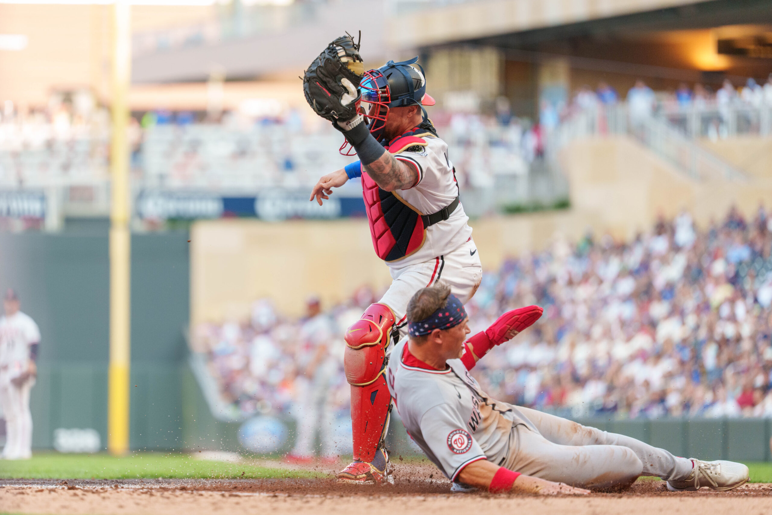 Jul 26, 2025; Minneapolis, Minnesota, USA; Washington Nationals outfielder Alex Call (17) scores on a hit by shortstop CJ Abrams (5) off Minnesota Twins starting pitcher Joe Ryan (41) in the fifth inning at Target Field. Mandatory Credit: Matt Blewett-Imagn Images