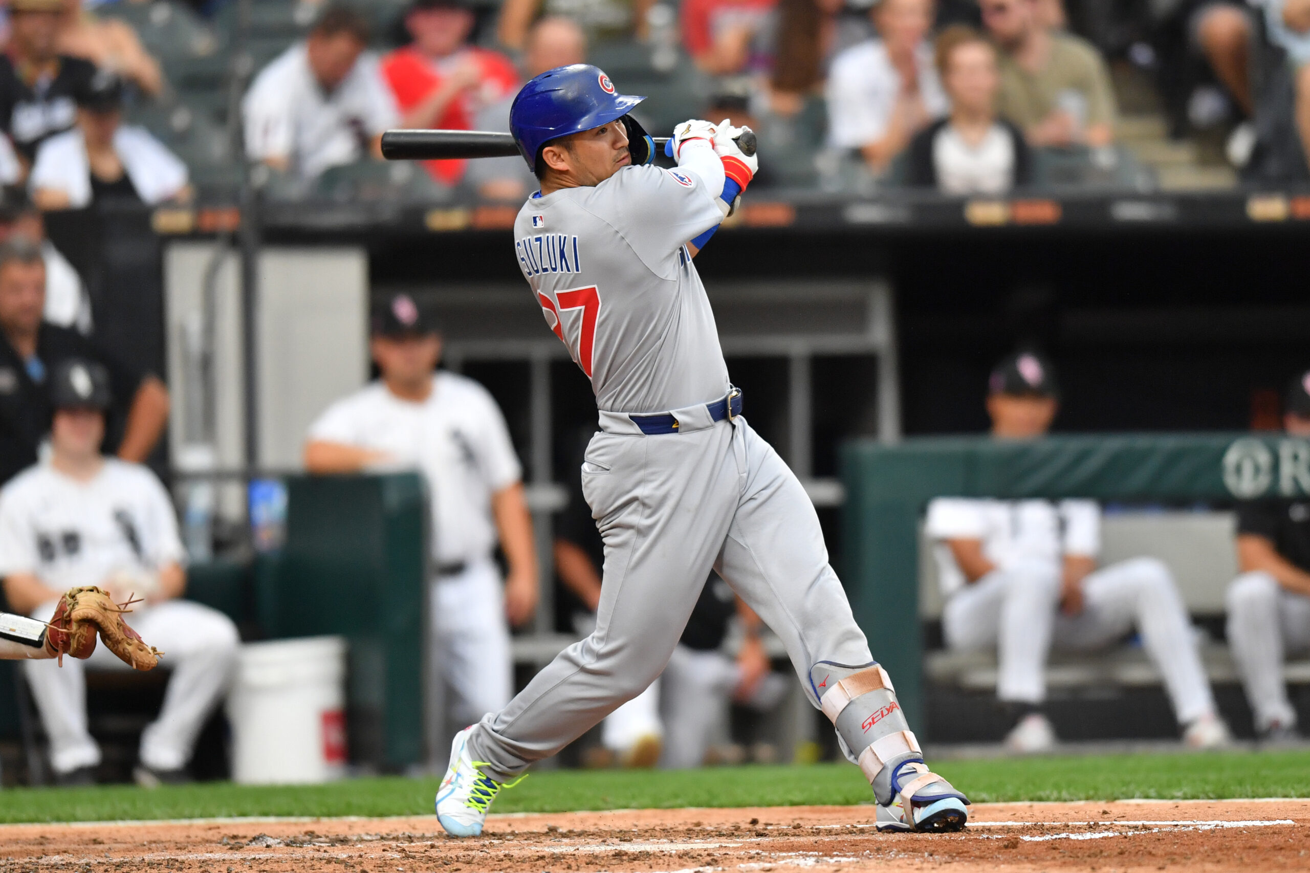 Jul 26, 2025; Chicago, Illinois, USA; Chicago Cubs designated hitter Seiya Suzuki (27) hits a single during the fourth inning against the Chicago White Sox at Rate Field. Mandatory Credit: Patrick Gorski-Imagn Images