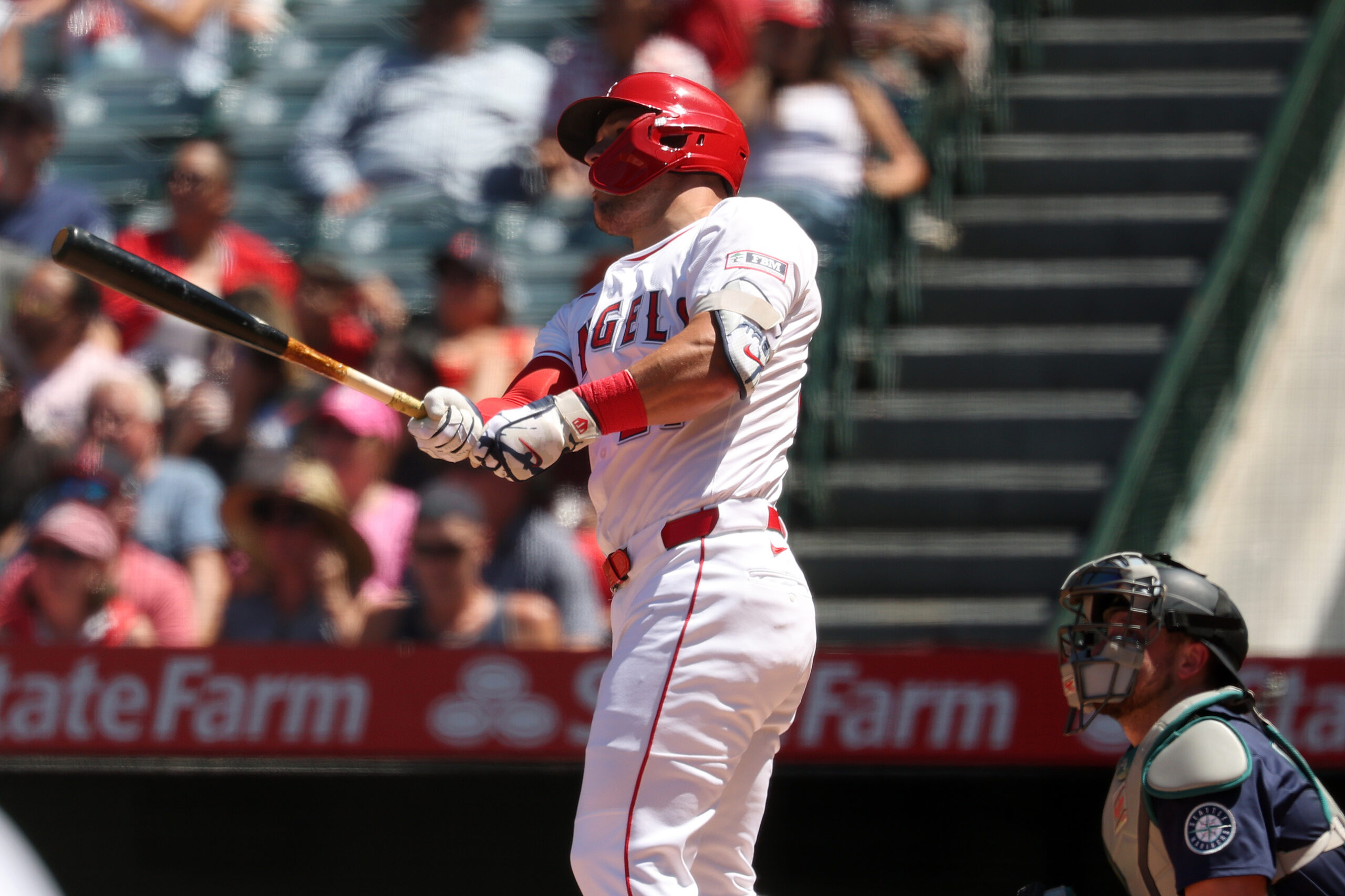 Jul 27, 2025; Anaheim, California, USA;  Los Angeles Angels designated hitter Mike Trout (27) hits a two-run home run for his 1,000th career RBI during the fifth inning against the Seattle Mariners at Angel Stadium. Mandatory Credit: Kiyoshi Mio-Imagn Images