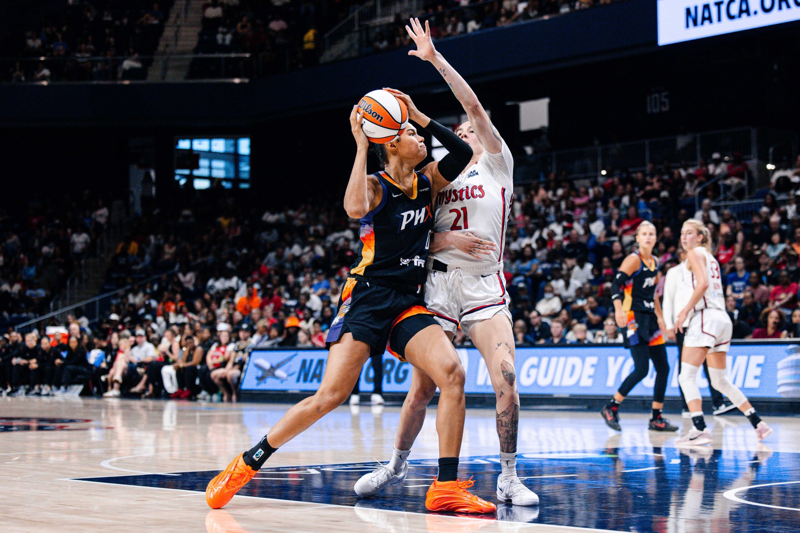 Jul 27, 2025; Washington, District of Columbia, USA; Phoenix Mercury forward Satou Sabally (0) prepares to shoot the ball while Washington Mystics forward Emily Engstler (21) defends in the second half at CareFirst Arena. Mandatory Credit: Emily Faith Morgan-Imagn Images