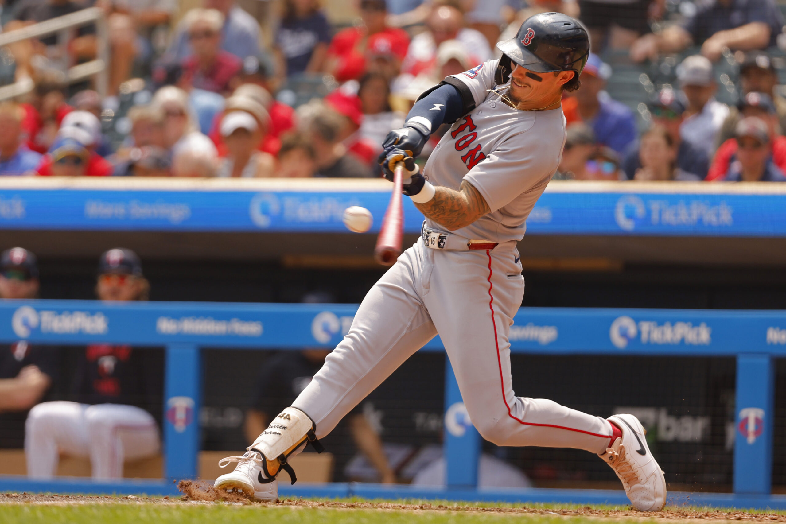 Jul 30, 2025; Minneapolis, Minnesota, USA; Boston Red Sox center fielder Jarren Duran (16) hits a two run home run against the Minnesota Twins in the sixth inning at Target Field. Mandatory Credit: Bruce Kluckhohn-Imagn Images