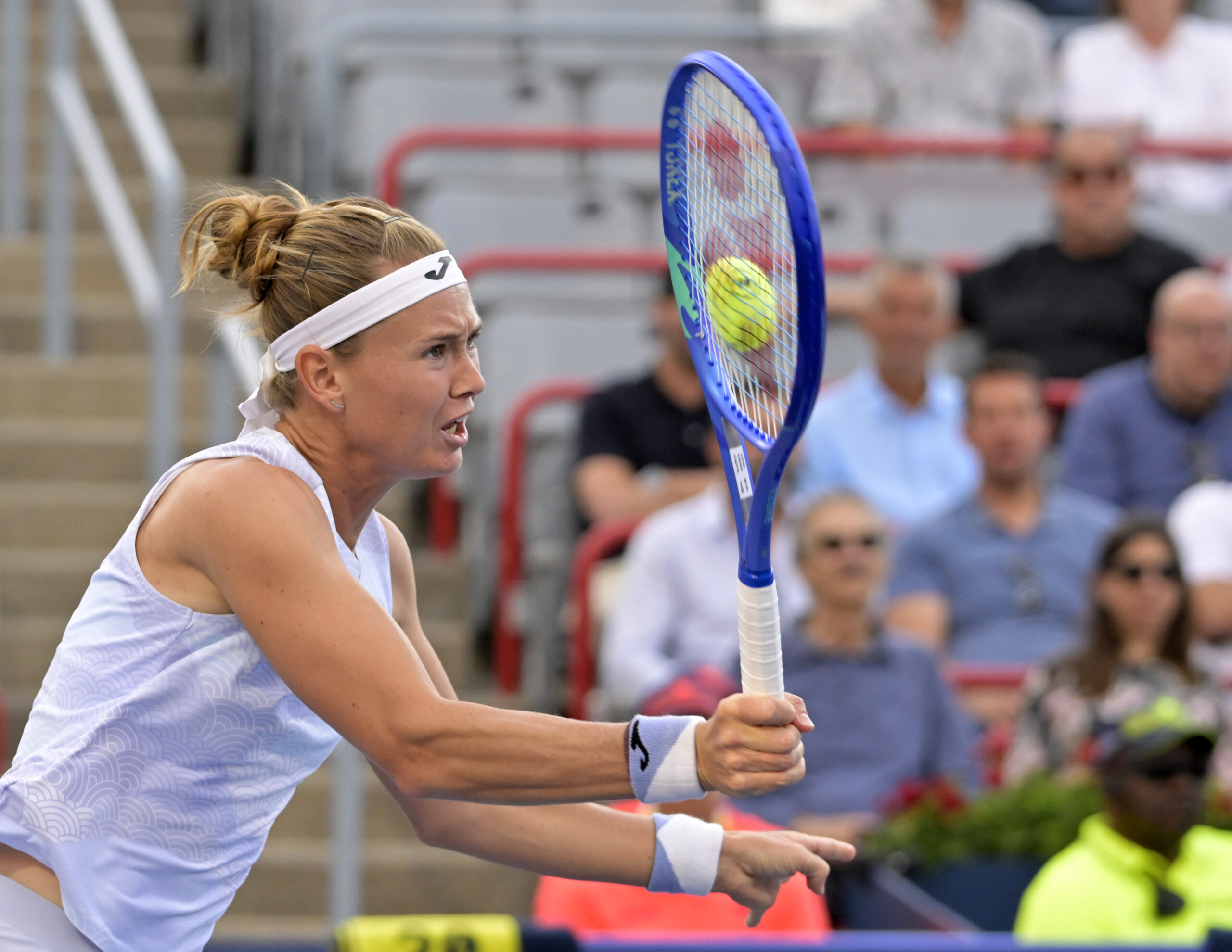 Jul 31, 2025; Montreal, QC, Canada; Marie Bouzkova (CZE) volleys against Victoria Mboko (CAN) in third round play at IGA Stadium. Mandatory Credit: Eric Bolte-Imagn Images
