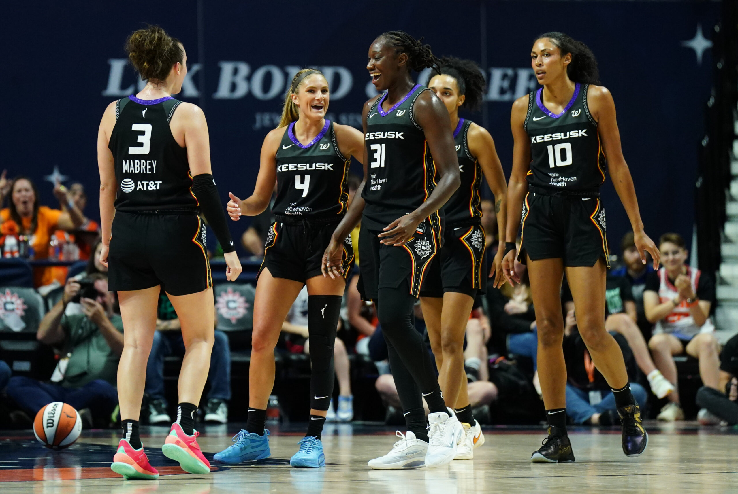 Aug 1, 2025; Uncasville, Connecticut, USA; Connecticut Sun center Tina Charles (31) and teammates react after a play against the New York Liberty in the second half at Mohegan Sun Arena. Mandatory Credit: David Butler II-Imagn Images