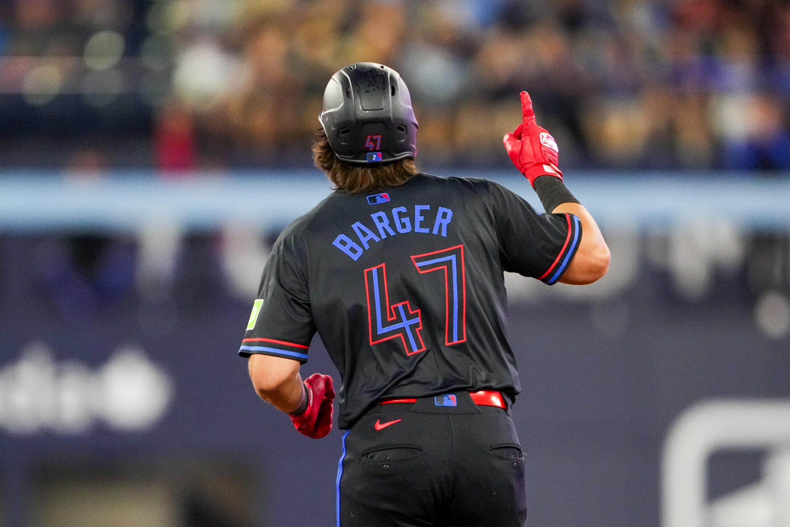Aug 1, 2025; Toronto, Ontario, CAN; Toronto Blue Jays third base Addison Barger (47) celebrates hitting a home run against the Kansas City Royals during the ninth inning at Rogers Centre. Mandatory Credit: Kevin Sousa-Imagn Images