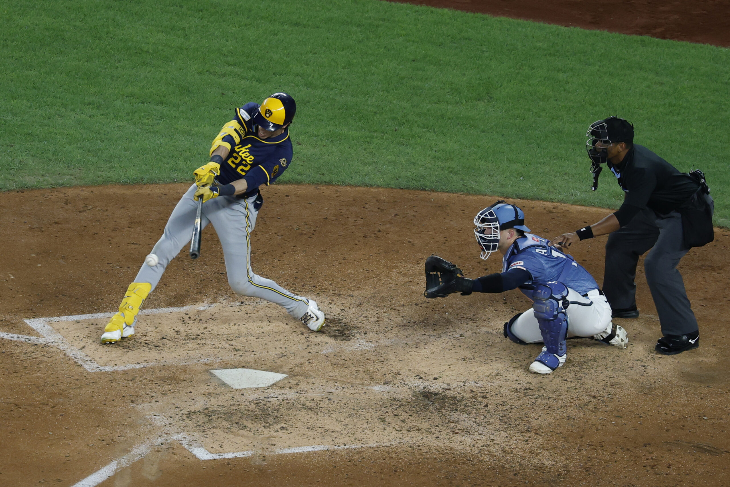 Aug 1, 2025; Washington, District of Columbia, USA; Milwaukee Brewers outfielder Christian Yelich (22) hits an RBI single against the Washington Nationals during the fifth inning at Nationals Park. Mandatory Credit: Geoff Burke-Imagn Images
