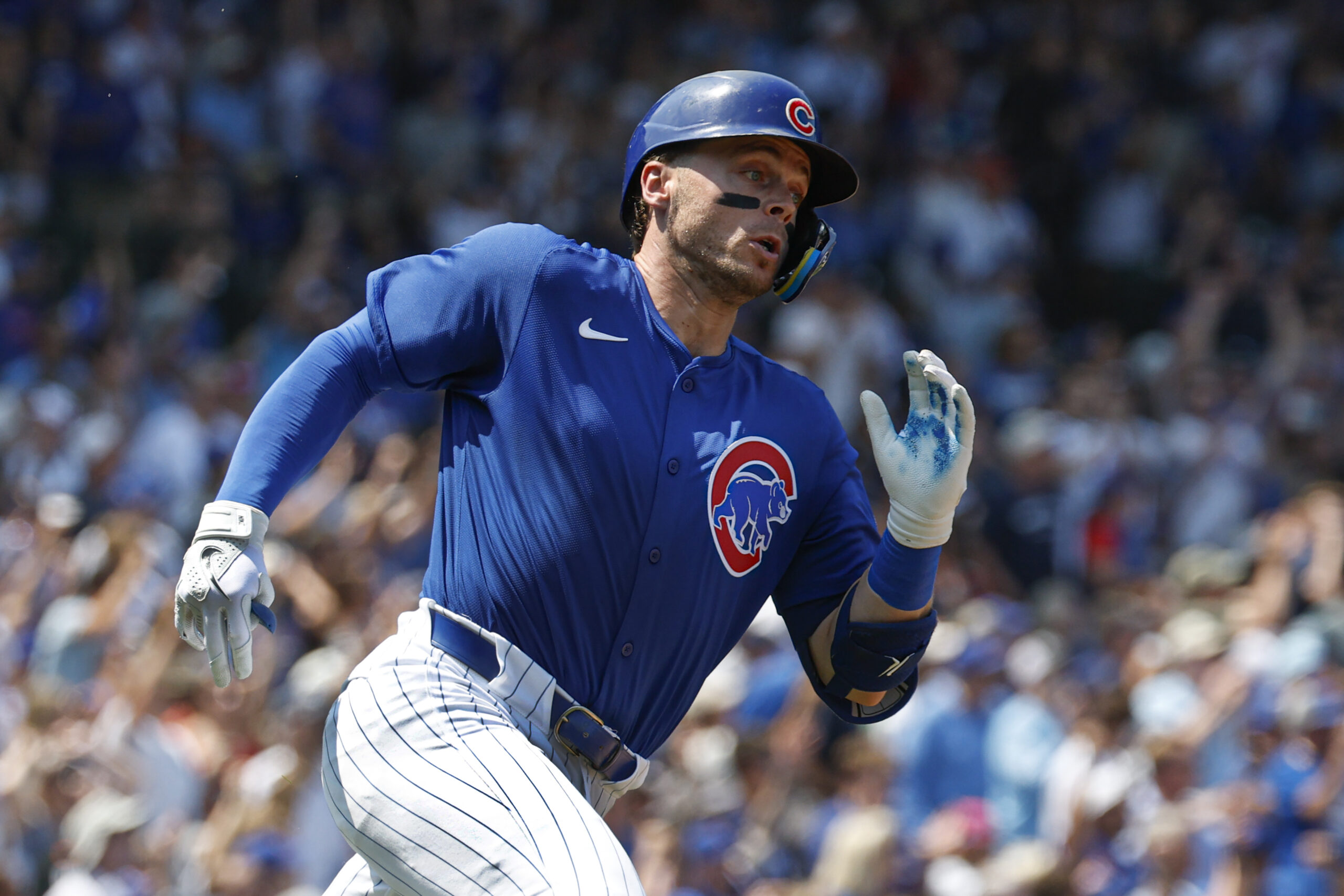 Aug 2, 2025; Chicago, Illinois, USA; Chicago Cubs shortstop Nico Hoerner  wearing number 23 in honor the late Hall of Fame second baseman Ryne Sandberg runs after hitting an RBI-ground rule double against the Baltimore Orioles during the second inning at Wrigley Field. Mandatory Credit: Kamil Krzaczynski-Imagn Images