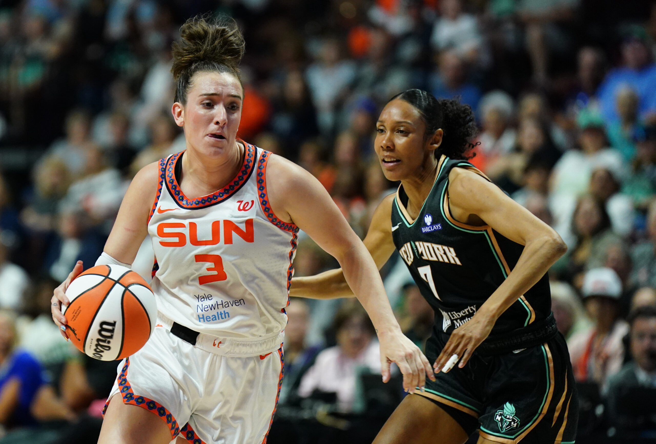 Aug 3, 2025; Uncasville, Connecticut, USA; Connecticut Sun guard Marina Mabrey (3) drives the ball against New York Liberty guard Rebekah Gardner (7) in the first half at Mohegan Sun Arena. Mandatory Credit: David Butler II-Imagn Images