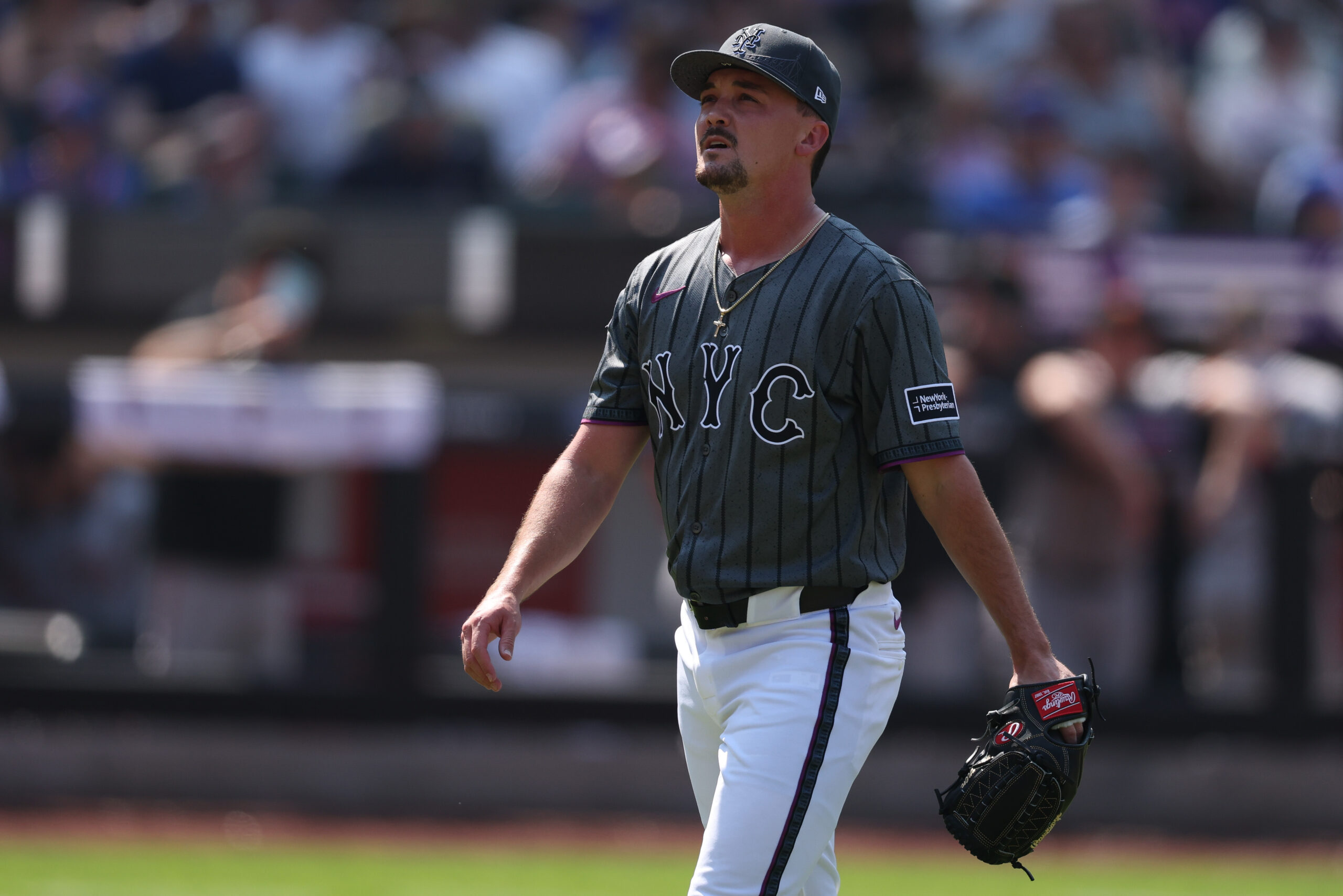 Aug 3, 2025; New York City, New York, USA; New York Mets relief pitcher Austin Warren (44) walks off the field after the top of the sixth inning against the San Francisco Giants at Citi Field. Mandatory Credit: Vincent Carchietta-Imagn Images