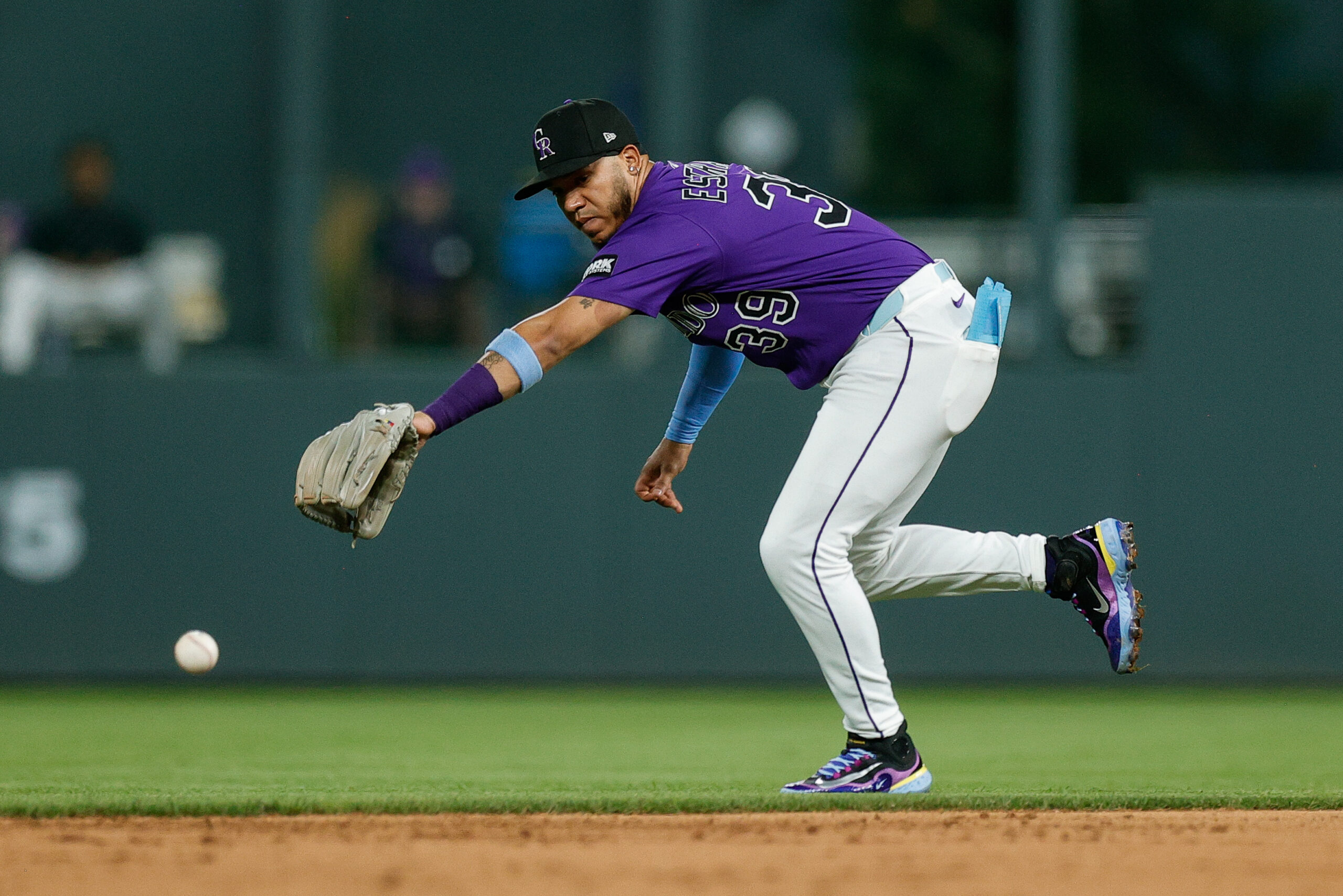 Aug 4, 2025; Denver, Colorado, USA; Colorado Rockies second baseman Thairo Estrada (39) is unable to field the ball in the ninth inning against the Toronto Blue Jays at Coors Field. Mandatory Credit: Isaiah J. Downing-Imagn Images
