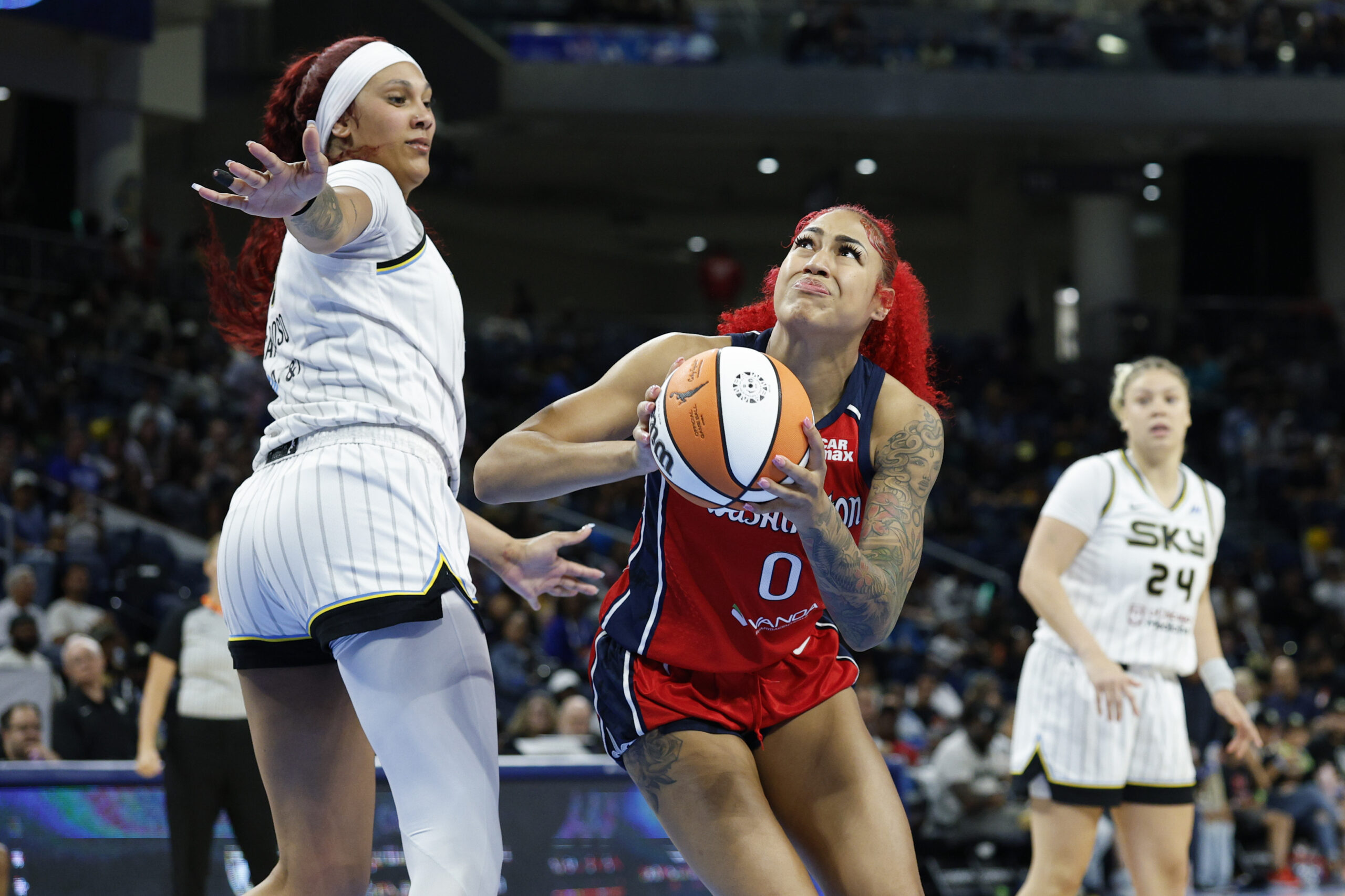 Aug 5, 2025; Chicago, Illinois, USA; Washington Mystics forward Shakira Austin (0) drives to the basket against Chicago Sky center Kamilla Cardoso (10) during the second half at Wintrust Arena. Mandatory Credit: Kamil Krzaczynski-Imagn Images