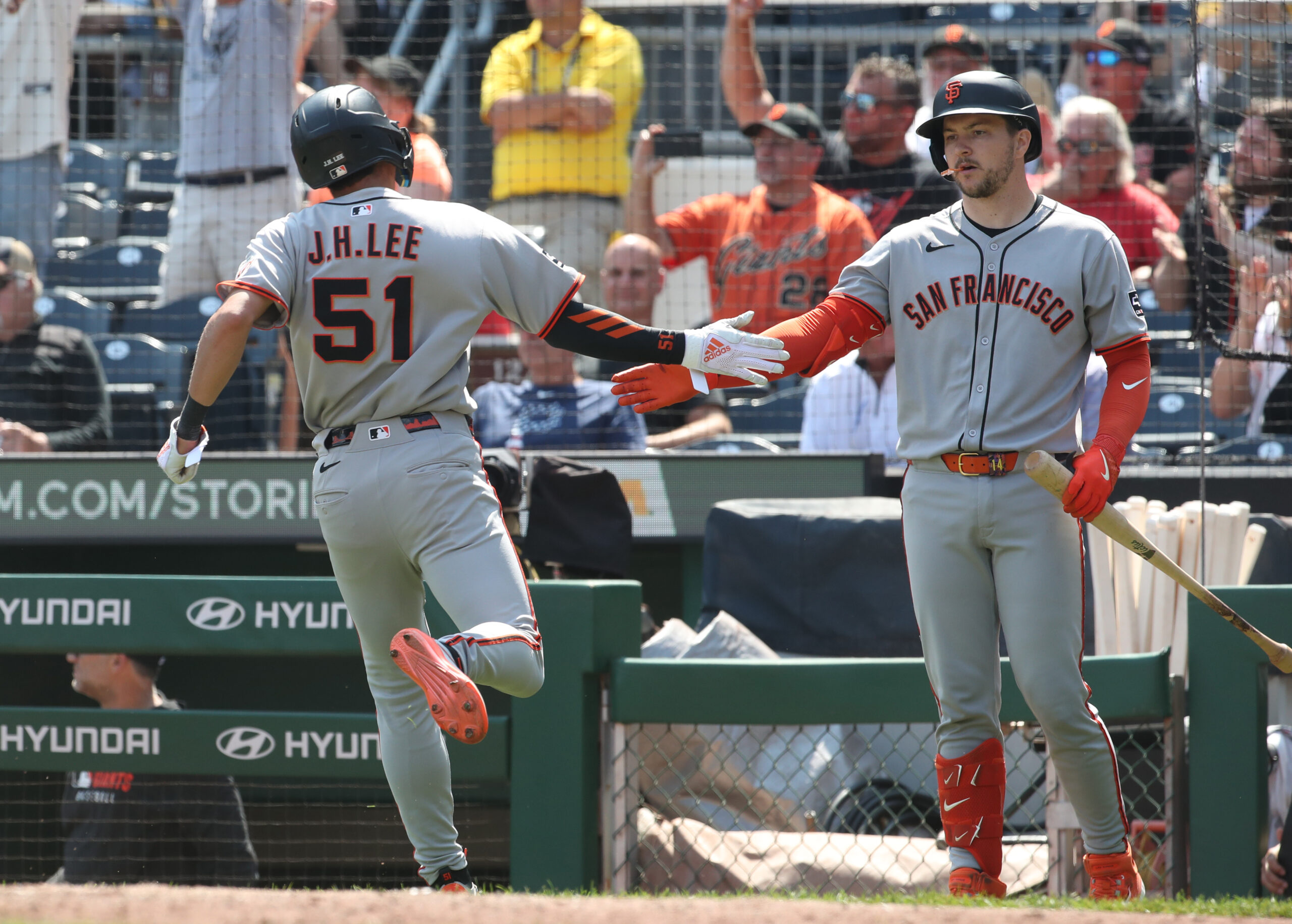 Aug 6, 2025; Pittsburgh, Pennsylvania, USA;  San Francisco Giants catcher Patrick Bailey (right) greets center fielder Jung Hoo Lee (51) crossing home plate to score the game winning run against the Pittsburgh Pirates during the ninth inning at PNC Park. Mandatory Credit: Charles LeClaire-Imagn Images