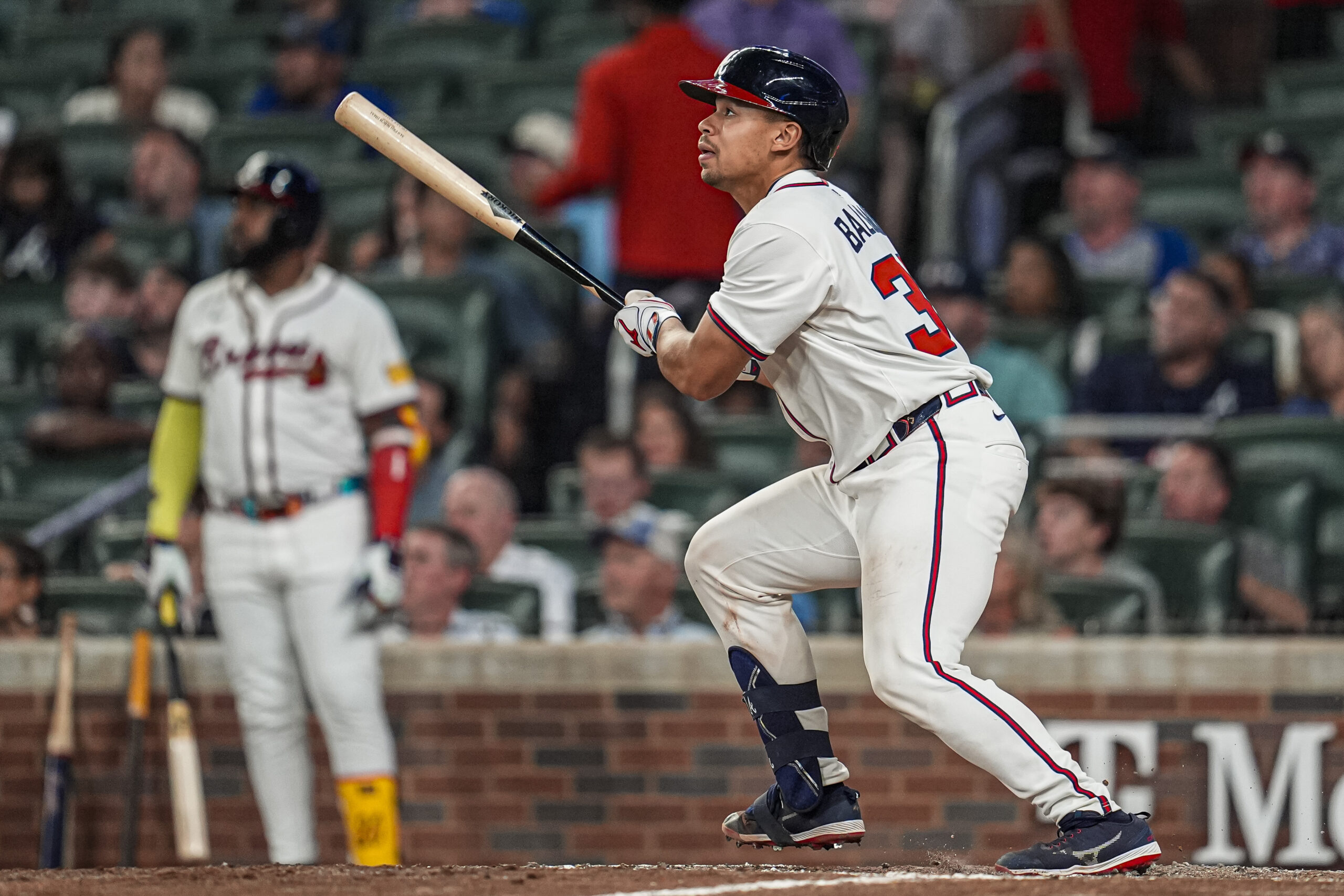 Aug 7, 2025; Cumberland, Georgia, USA; Atlanta Braves catcher Drake Baldwin (30) hits a three run home run against the Miami Marlins during the eighth inning at Truist Park. Mandatory Credit: Dale Zanine-Imagn Images