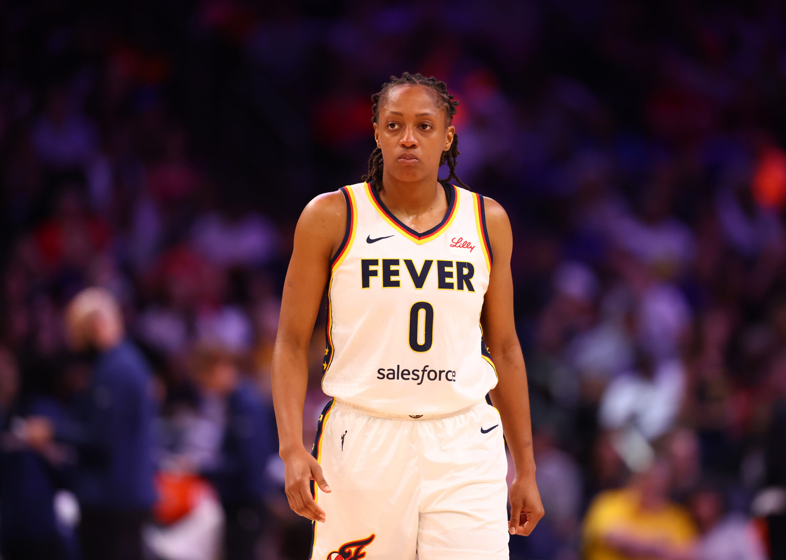 Aug 7, 2025; Phoenix, Arizona, USA; Indiana Fever guard Kelsey Mitchell (0) against the Phoenix Mercury during an WNBA game at PHX Arena. Mandatory Credit: Mark J. Rebilas-Imagn Images
