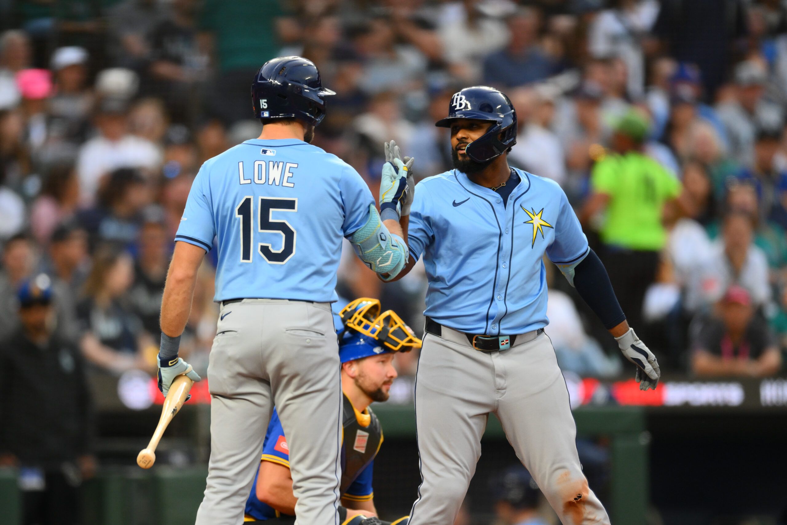 Aug 8, 2025; Seattle, Washington, USA; Tampa Bay Rays right fielder Josh Lowe (15) and third baseman Junior Caminero (13) celebrate after Caminero hit a home run against the Seattle Mariners during the sixth inning at T-Mobile Park. Mandatory Credit: Steven Bisig-Imagn Images