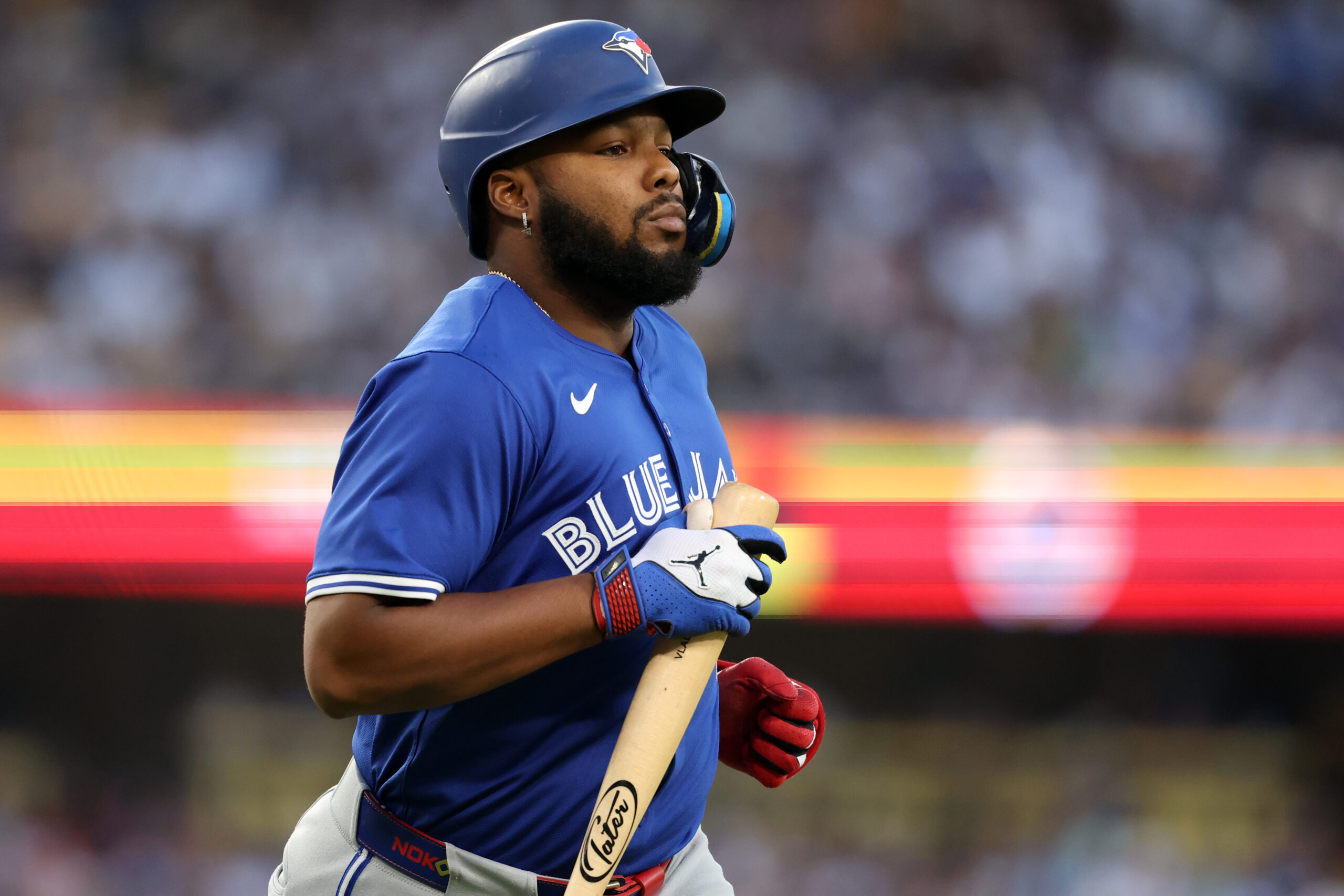 Aug 9, 2025; Los Angeles, California, USA;  Toronto Blue Jays designated hitter Vladimir Guerrero Jr. (27) reacts  during the fifth inning against the Los Angeles Dodgers at Dodger Stadium. Mandatory Credit: Kiyoshi Mio-Imagn Images