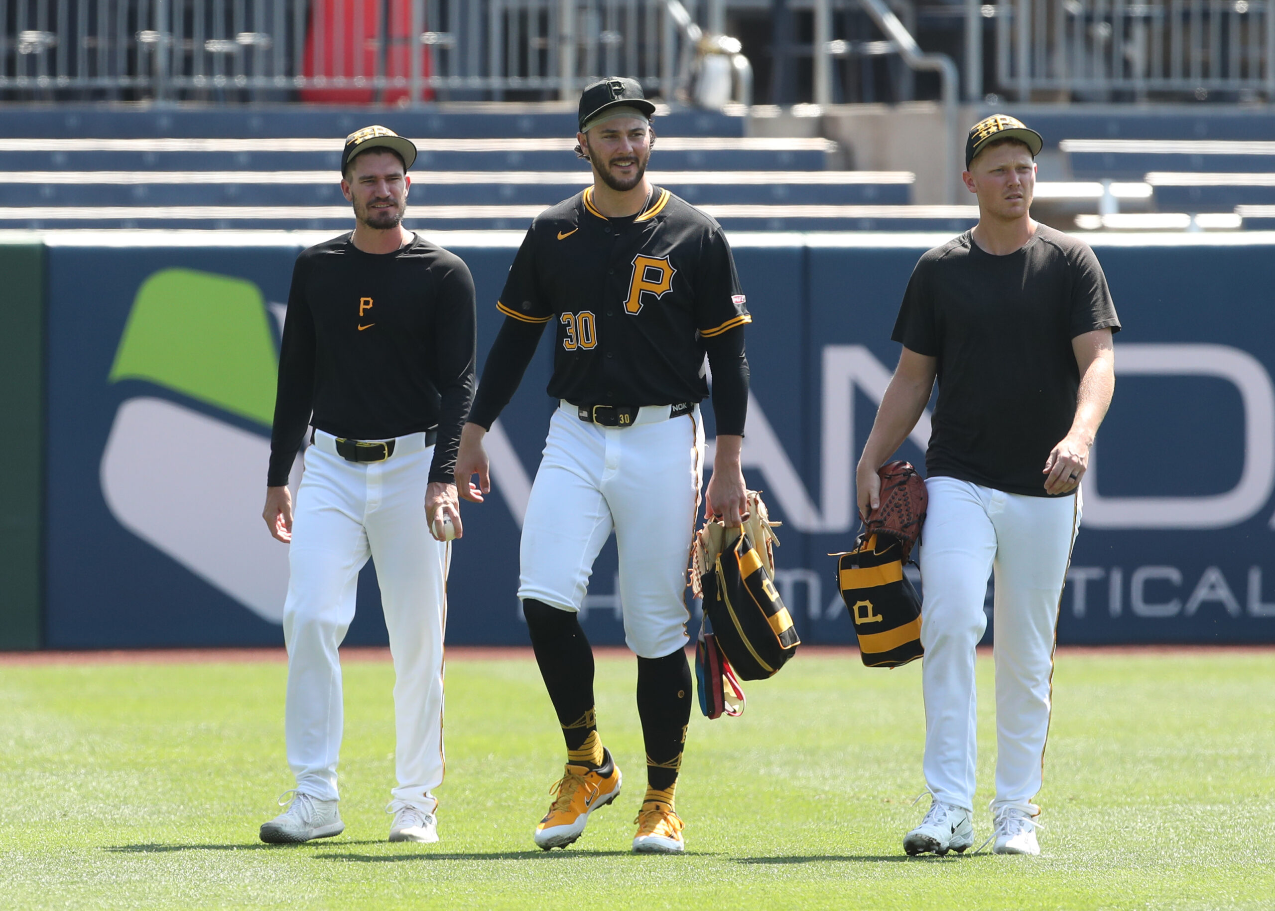 Aug 10, 2025; Pittsburgh, Pennsylvania, USA;  Pittsburgh Pirates pitchers Andrew Heaney (left) and Paul Skenes (30) and Mitch Keller (right) walk in from the bullpen before the game against the Cincinnati Reds at PNC Park. Mandatory Credit: Charles LeClaire-Imagn Images
