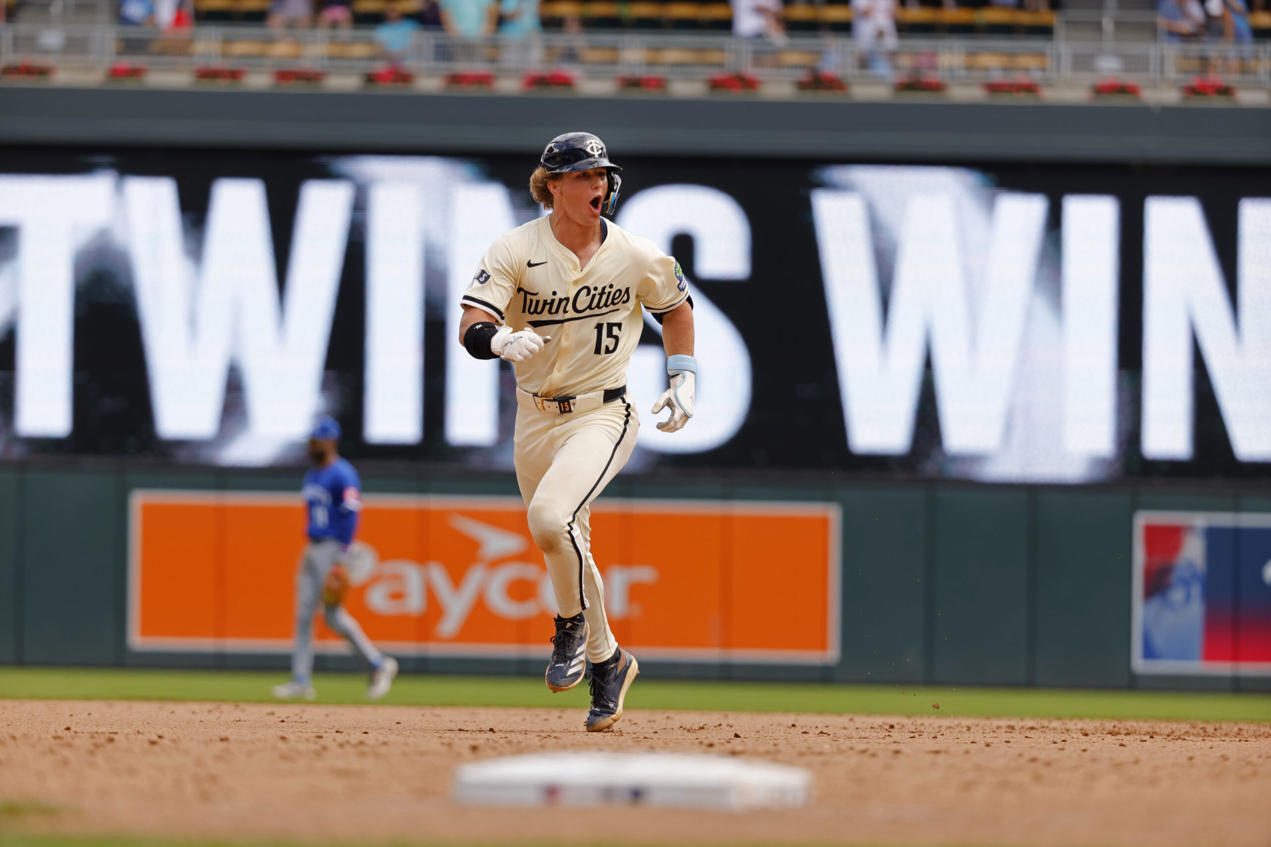 Aug 10, 2025; Minneapolis, Minnesota, USA; Minnesota Twins second baseman Luke Keaschall (15) runs the bases and celebrates his two-run, walk-off home run against the Kansas City Royals in the 11th inning at Target Field. Mandatory Credit: Bruce Kluckhohn-Imagn Images