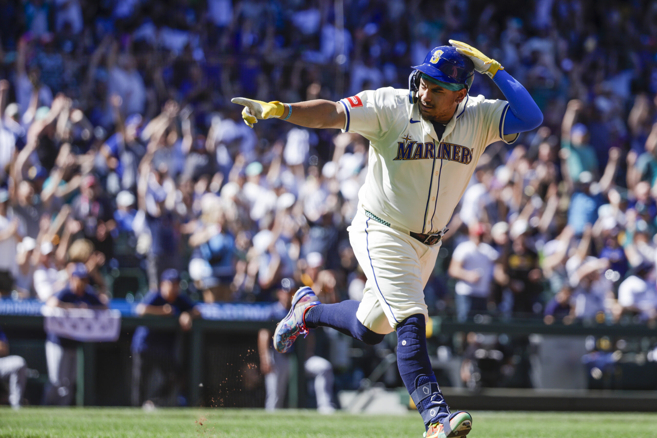 Aug 10, 2025; Seattle, Washington, USA; Seattle Mariners first baseman Josh Naylor (12) points to the Mariners dugout after hitting a solo-home run against the Tampa Bay Rays  during the seventh inning at T-Mobile Park. Mandatory Credit: Joe Nicholson-Imagn Images