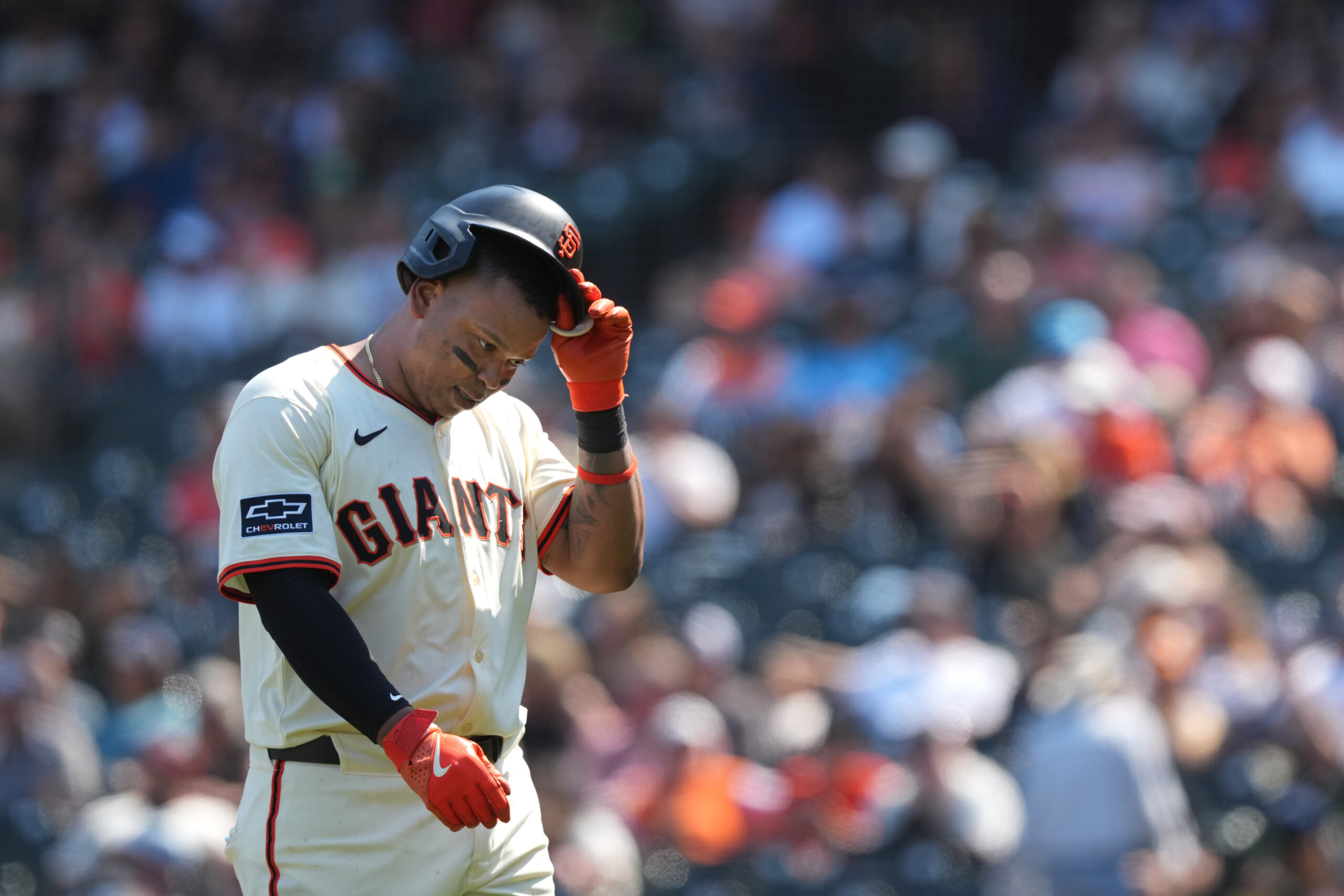 Aug 10, 2025; San Francisco, California, USA; San Francisco Giants first baseman Rafael Devers (16) walks to the dugout after grounding out against the Washington Nationals during the ninth inning at Oracle Park. Mandatory Credit: Darren Yamashita-Imagn Images