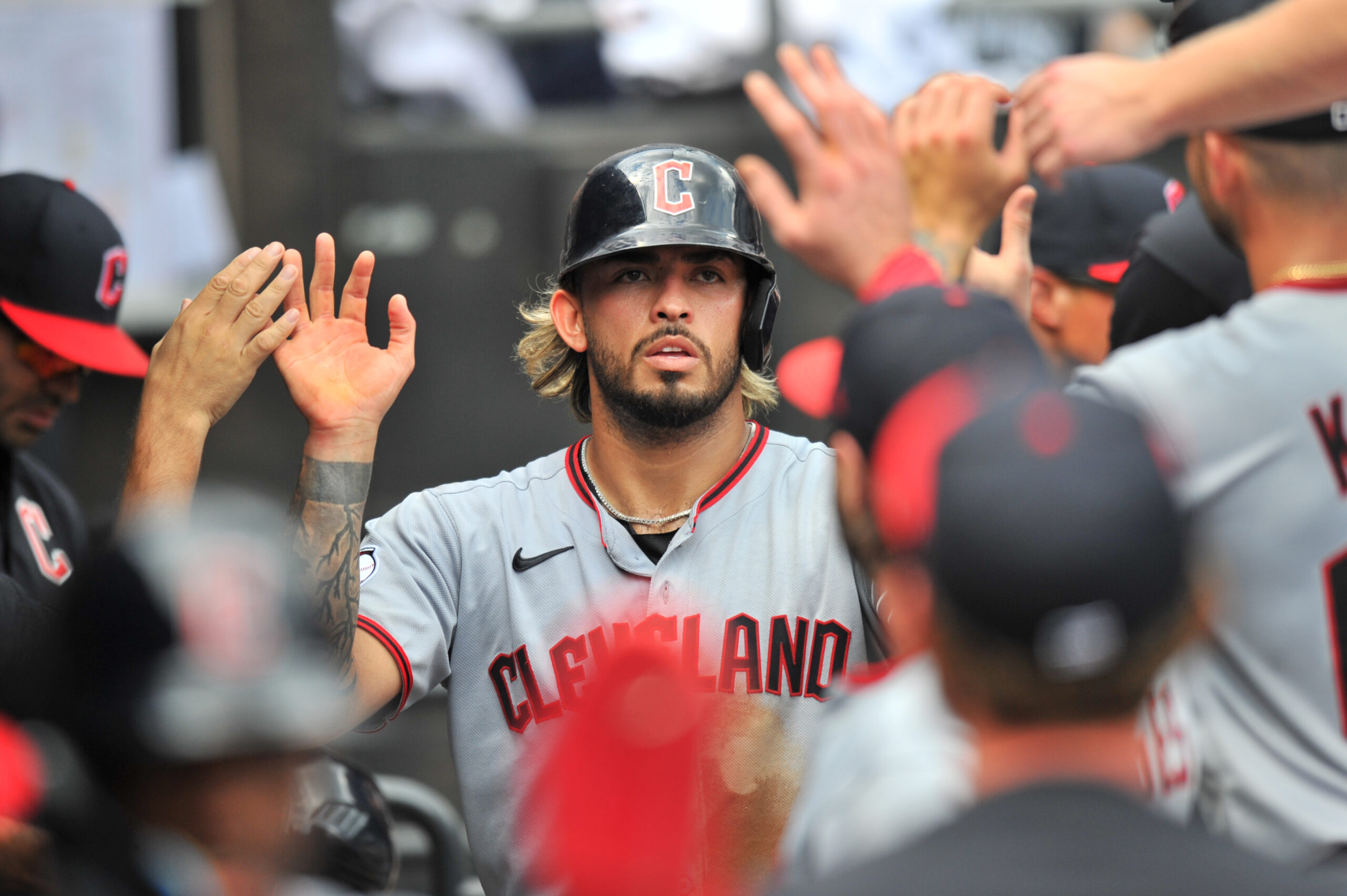 Aug 10, 2025; Chicago, Illinois, USA; Cleveland Guardians shortstop Gabriel Arias (13) celebrates with teammates in the dugout after scoring during the sixth inning against the Chicago White Sox at Rate Field. Mandatory Credit: Patrick Gorski-Imagn Images
