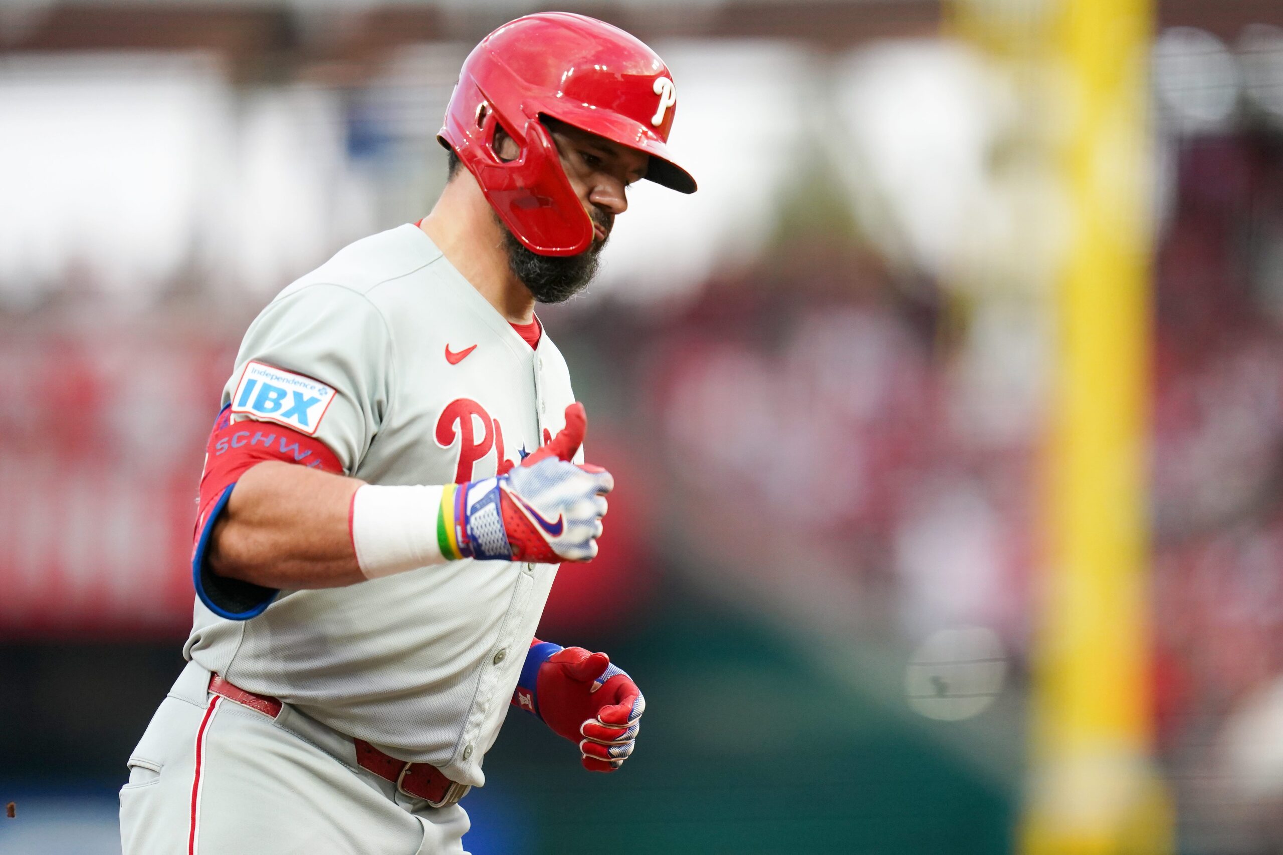 Philadelphia Phillies designated hitter Kyle Schwarber (12) gestures while running the bases after hitting a home run in the eighth inning of a MLB game between the Cincinnati Reds and Philadelphia Phillies, Monday, Aug. 11, 2025, at Great American Ball Park in downtown Cincinnati. Phillies won 4-1.
