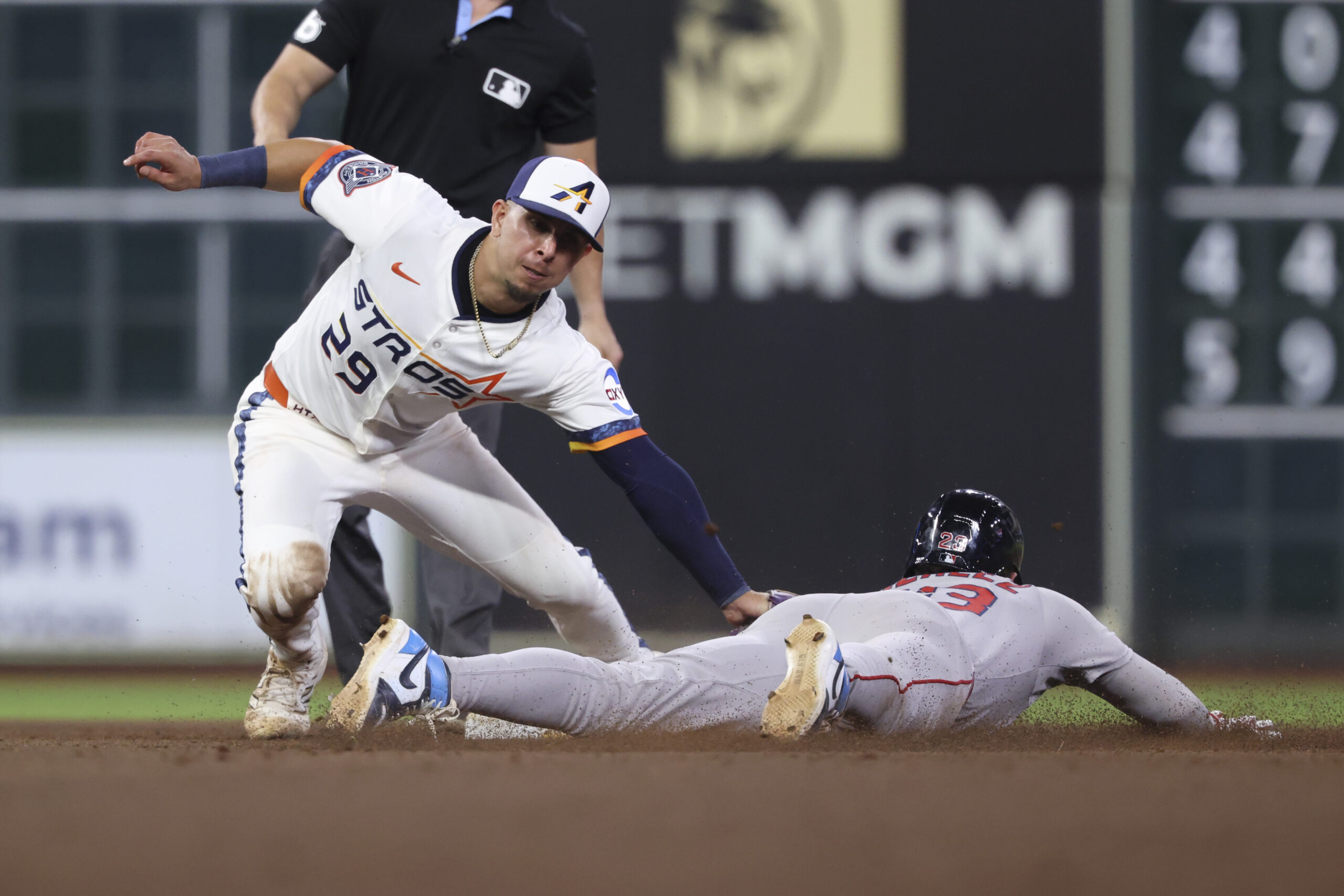 Aug 11, 2025; Houston, Texas, USA; Boston Red Sox second baseman Romy Gonzalez (23) is out on an attempted stolen base as Houston Astros secon baseman Ramon Urias (29) applies a tag during the eighth inning at Daikin Park. Mandatory Credit: Troy Taormina-Imagn Images