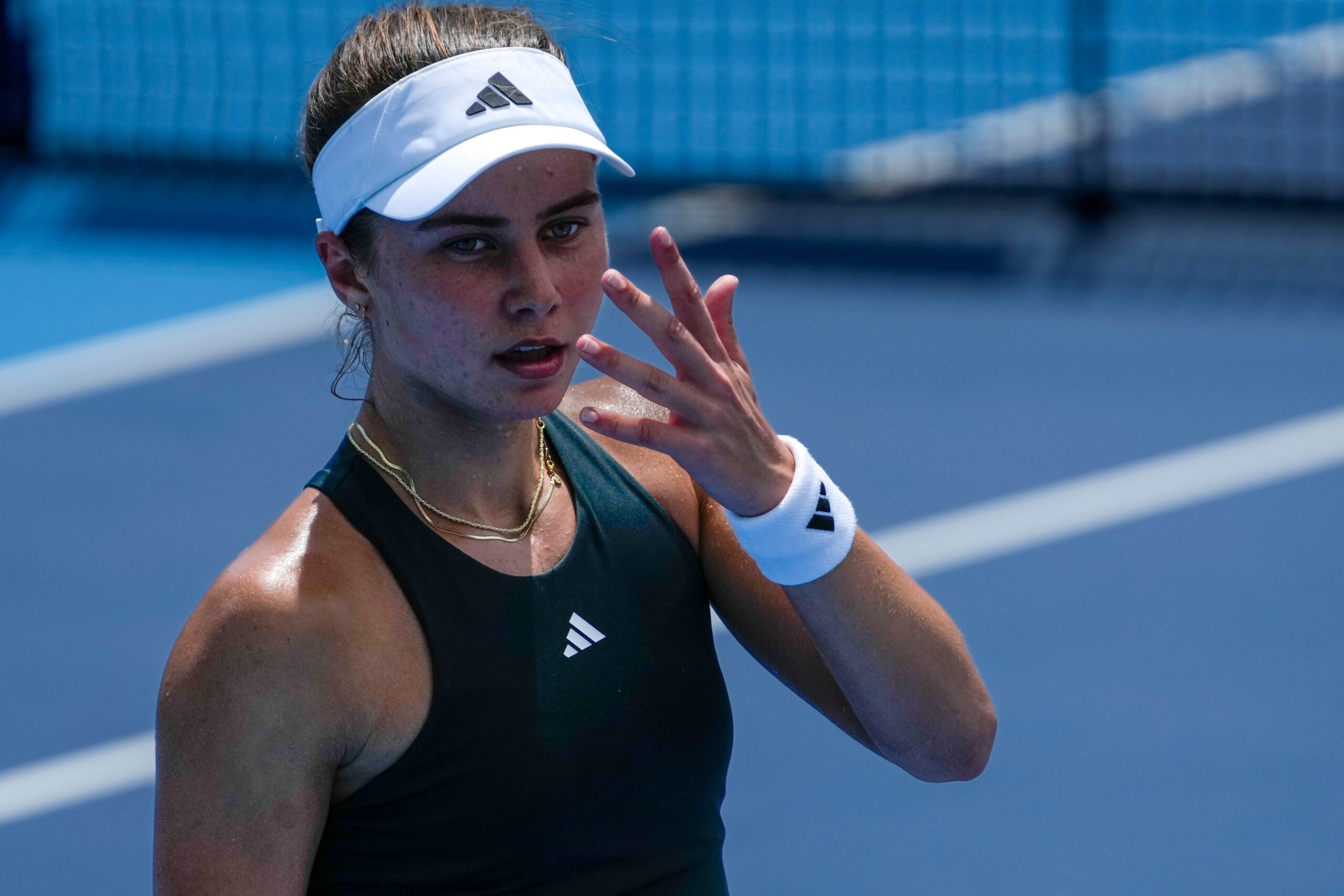 Iva Jovic asks for a towel in the Cincinnati Open third-round match with Barbora Krejcikova at the Lindner Family Tennis Center in Mason, Ohio, on Tuesday, Aug. 12, 2025. Krejcikova won, 6-4, 3-6, 6-2.