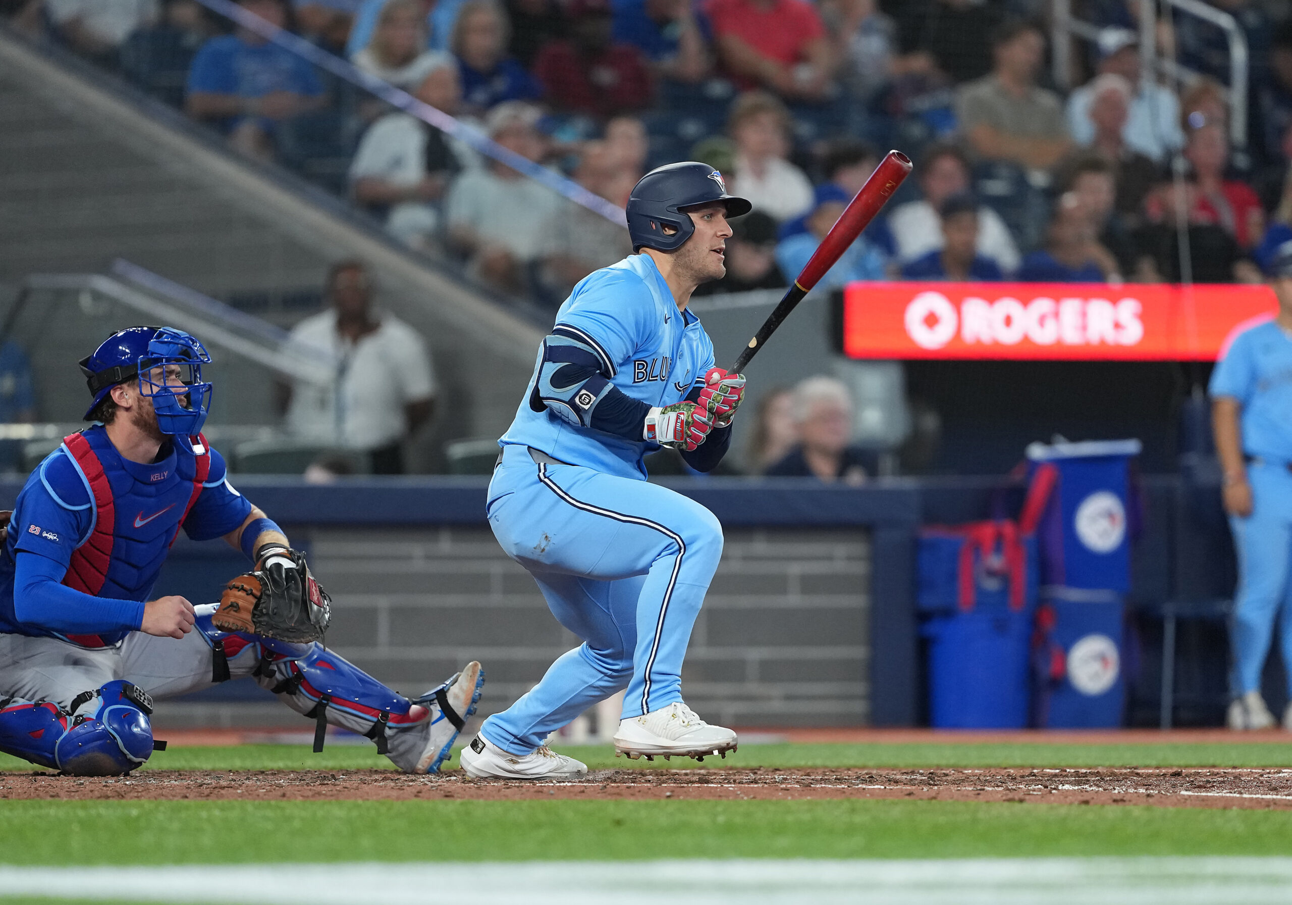 Aug 12, 2025; Toronto, Ontario, CAN; Toronto Blue Jays centre fielder Daulton Varsho (5) hits a single against the Chicago Cubs during the fifth inning at Rogers Centre. Mandatory Credit: Nick Turchiaro-Imagn Images