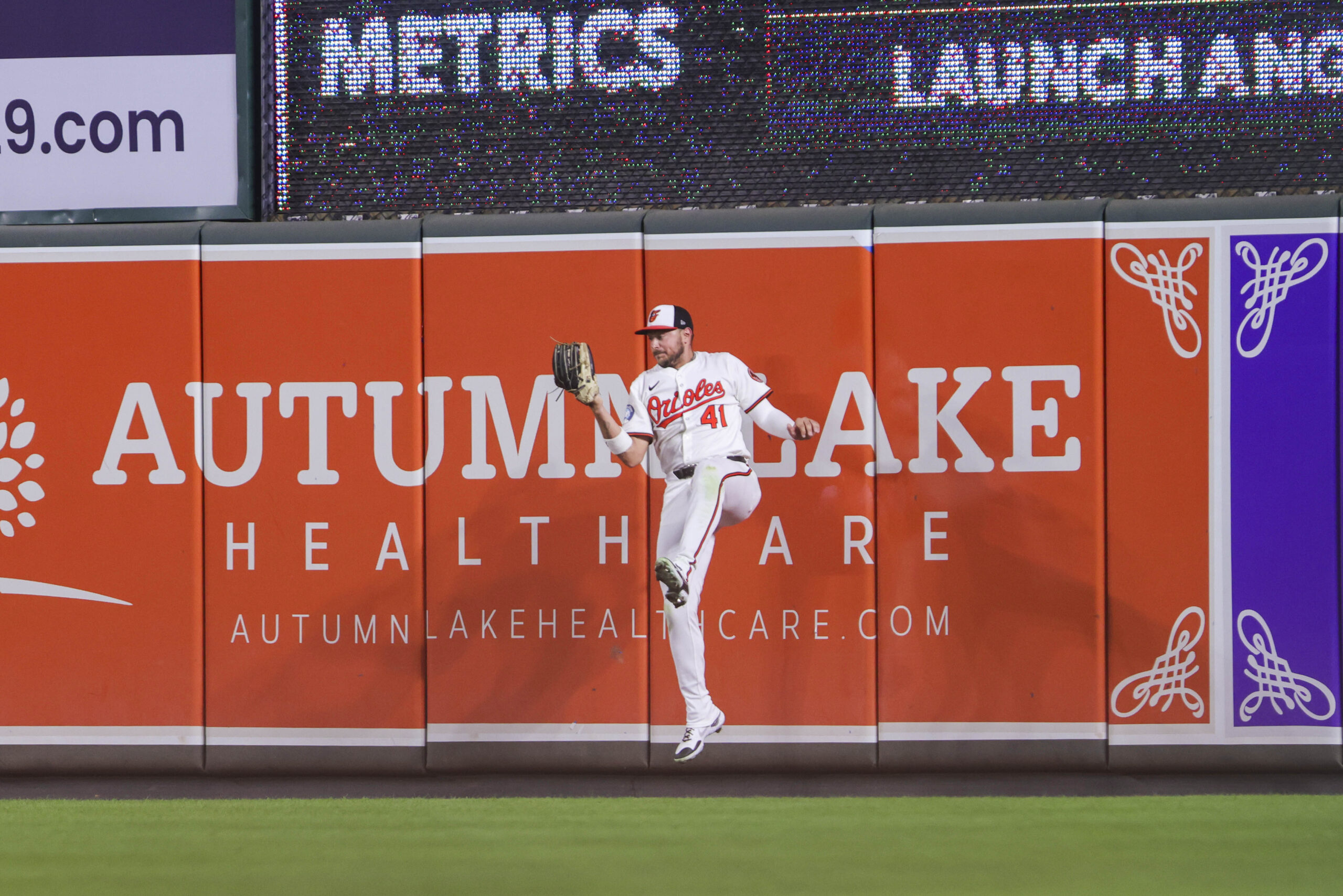 Aug 12, 2025; Baltimore, Maryland, USA; Baltimore Orioles right fielder Ryan Noda (41) makes a jumping catch for the out in the eighth inning agains the Seattle Mariners at Oriole Park at Camden Yards. Mandatory Credit: Lexi Thompson-Imagn Images