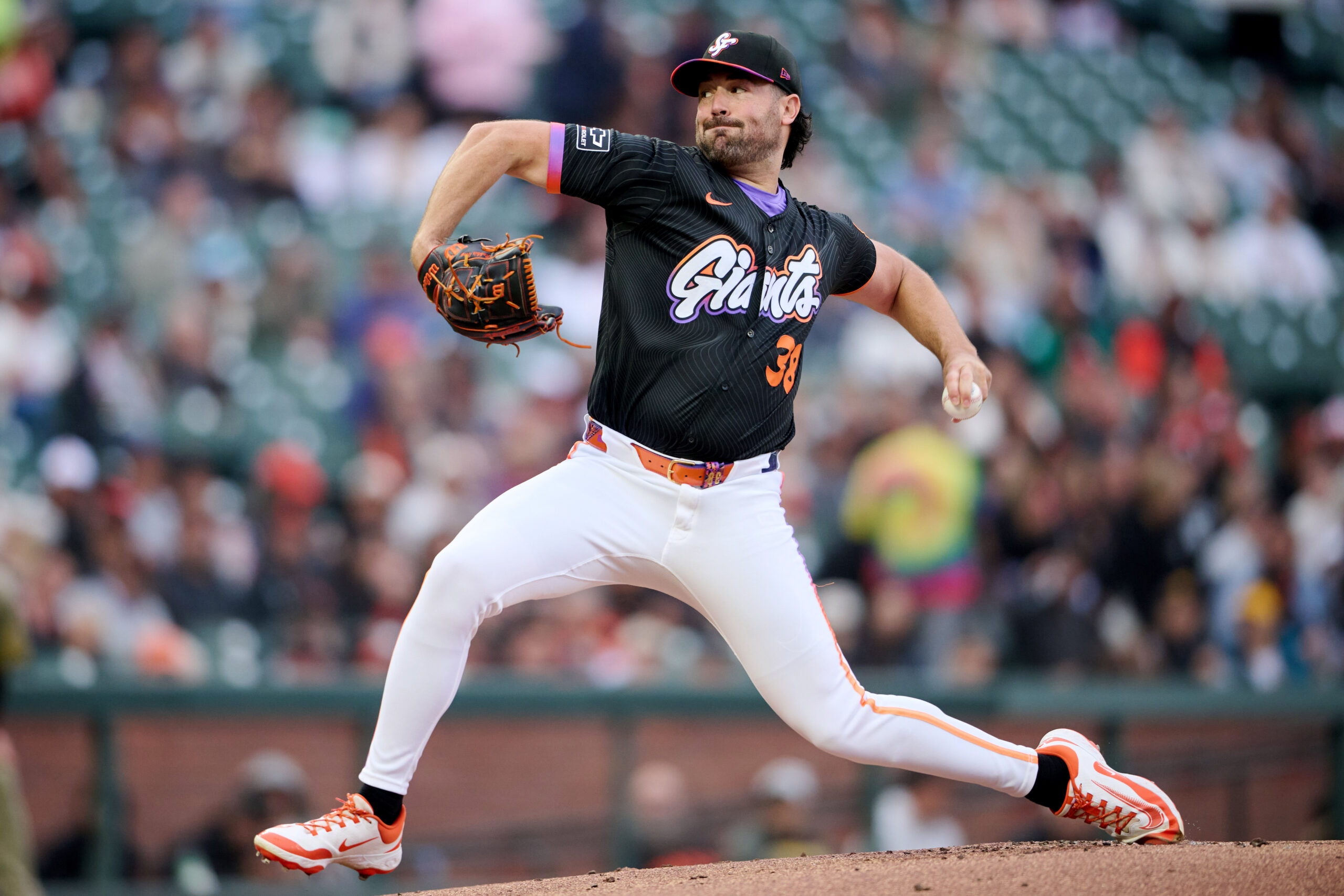 Aug 12, 2025; San Francisco, California, USA; San Francisco Giants starting pitcher Robbie Ray (38) throws a pitch against the San Diego Padres during the first inning at Oracle Park. Mandatory Credit: Robert Edwards-Imagn Images