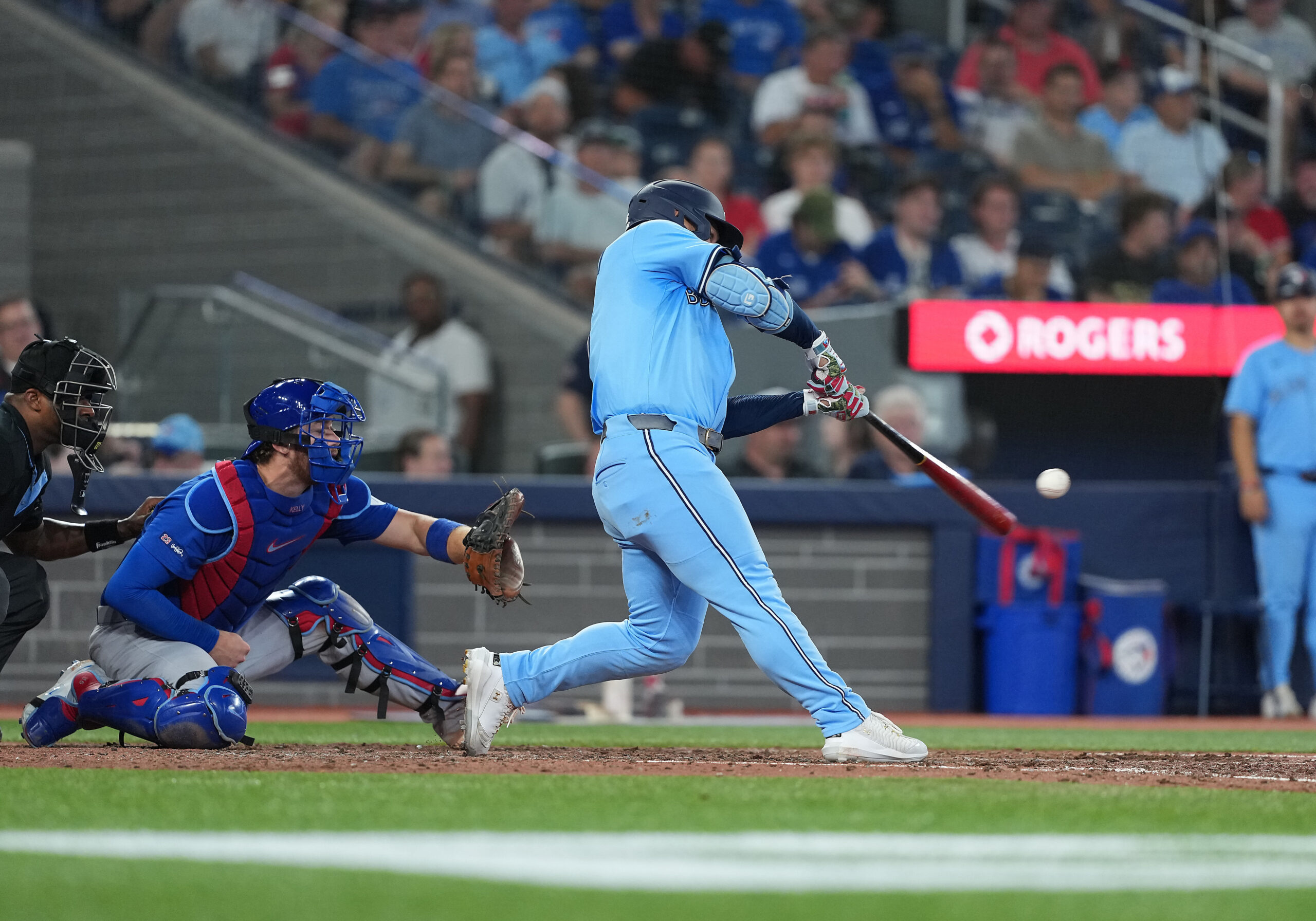 Aug 12, 2025; Toronto, Ontario, CAN; Toronto Blue Jays centre fielder Daulton Varsho (5) hits a home run against the Chicago Cubs during the eighth inning at Rogers Centre. Mandatory Credit: Nick Turchiaro-Imagn Images