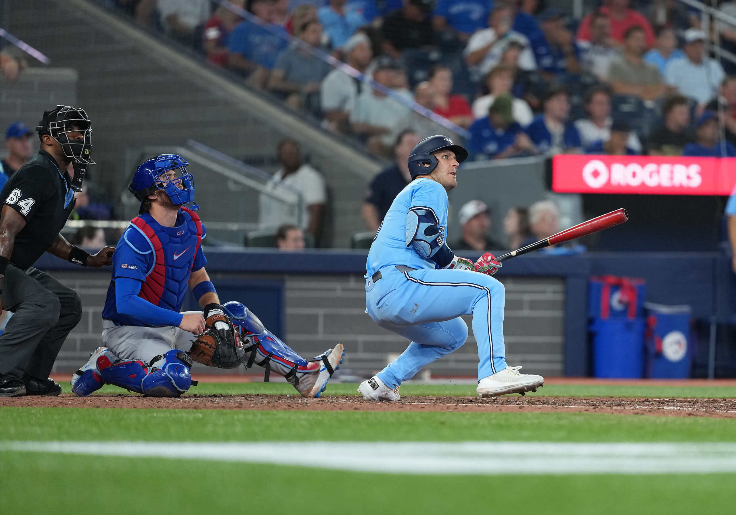 Aug 12, 2025; Toronto, Ontario, CAN; Toronto Blue Jays centre fielder Daulton Varsho (5) reacts after hitting a home run against the Chicago Cubs during the eighth inning at Rogers Centre. Mandatory Credit: Nick Turchiaro-Imagn Images