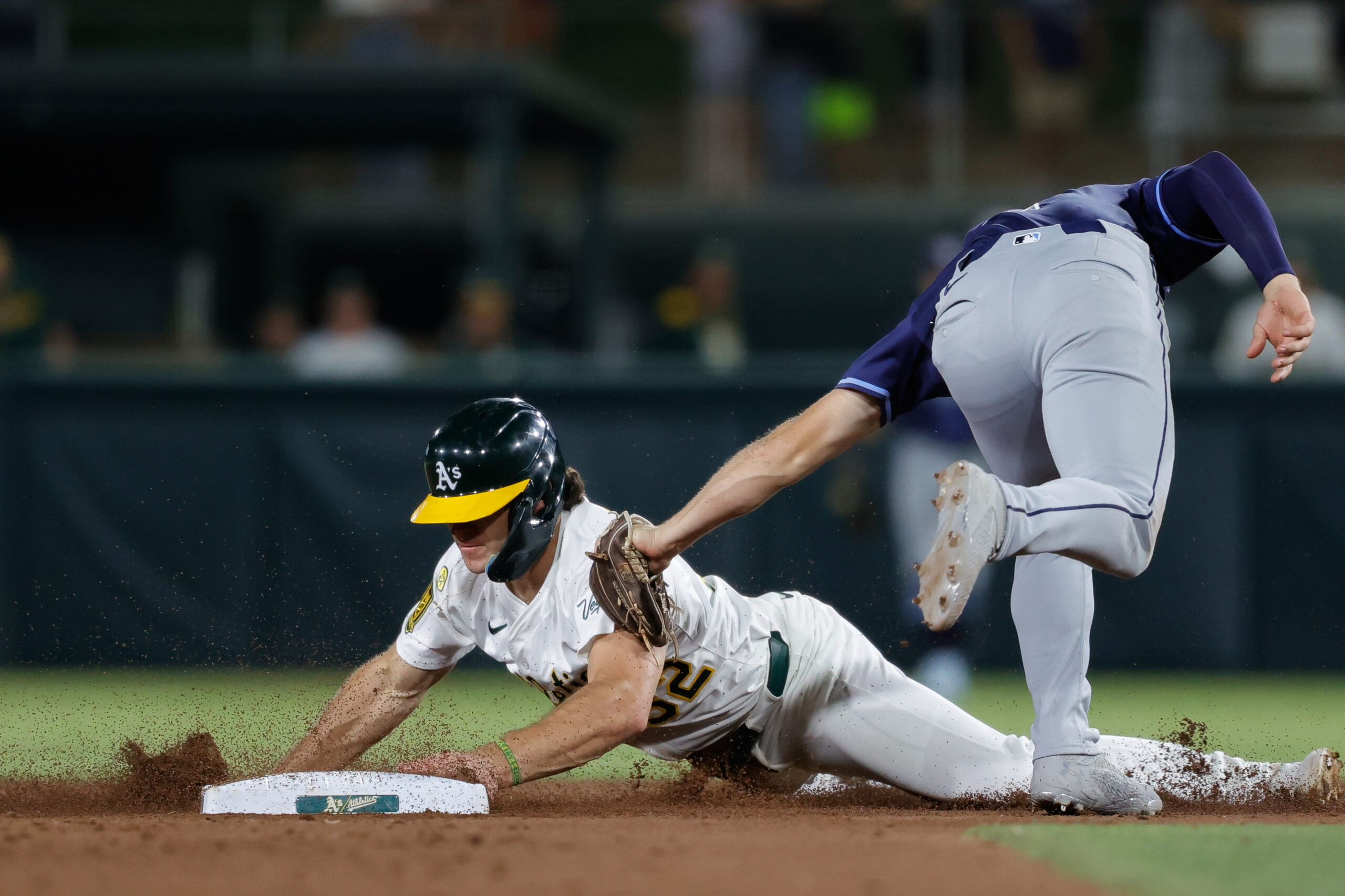 Aug 12, 2025; West Sacramento, California, USA; Athletics right fieler Colby Thomas (32) steals second base during the eighth inning against the Tampa Bay Rays at Sutter Health Park. Mandatory Credit: Sergio Estrada-Imagn Images