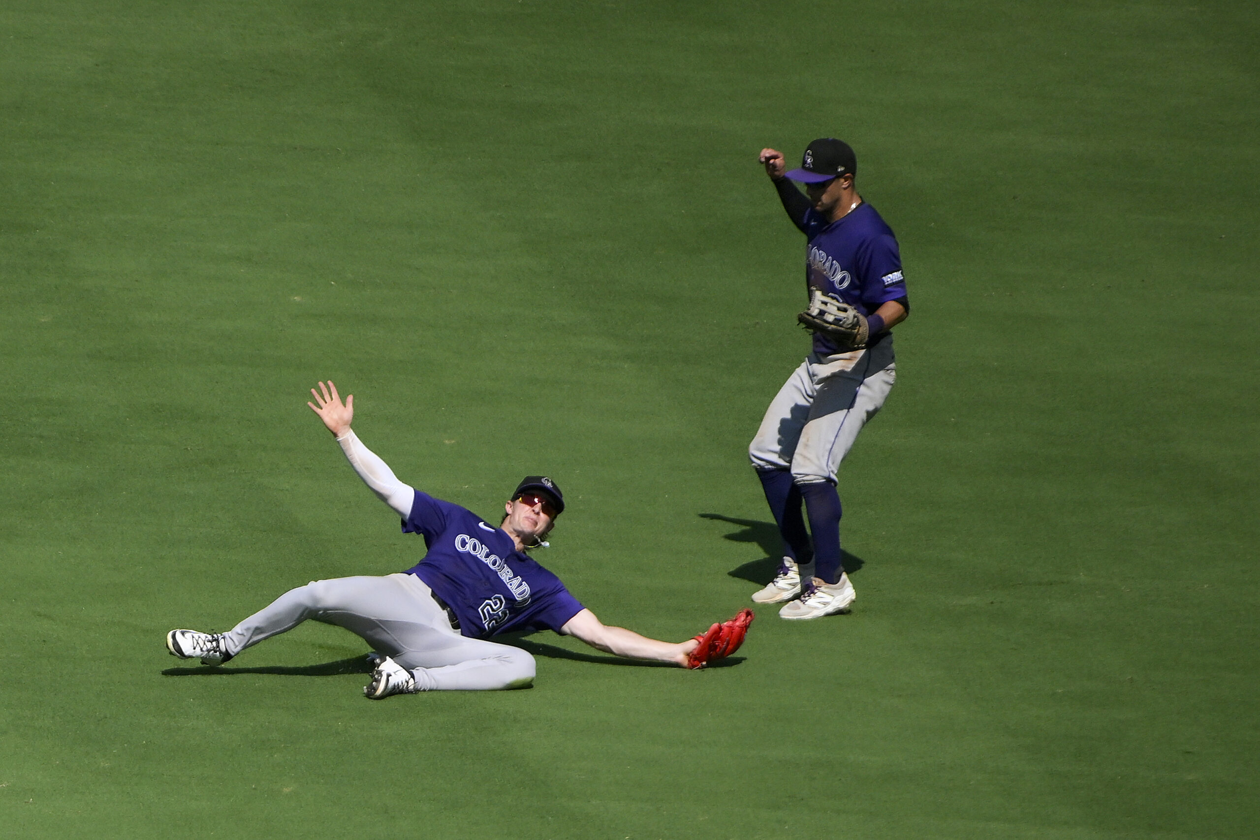 Aug 13, 2025; St. Louis, Missouri, USA; Colorado Rockies center fielder Mickey Moniak (22) dives and catches a line drive hit by St. Louis Cardinals catcher Pedro Pages (not pictured) during the ninth inning at Busch Stadium. Mandatory Credit: Jeff Curry-Imagn Images
