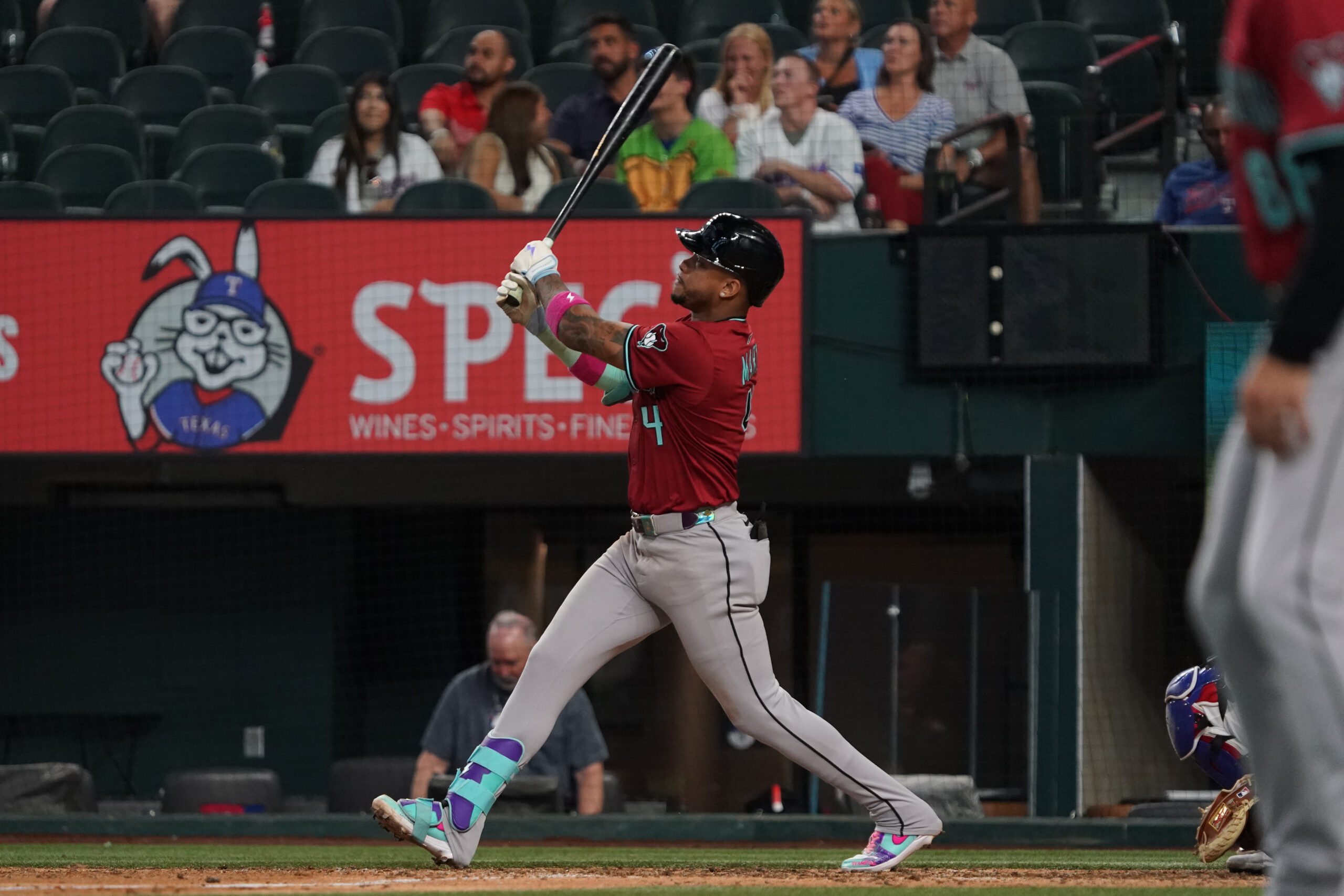 Aug 13, 2025; Arlington, Texas, USA; Arizona Diamondbacks second baseman Ketel Marte (4) follows through on a three-run home run during the ninth inning against the Texas Rangers at Globe Life Field. Mandatory Credit: Raymond Carlin III-Imagn Images
