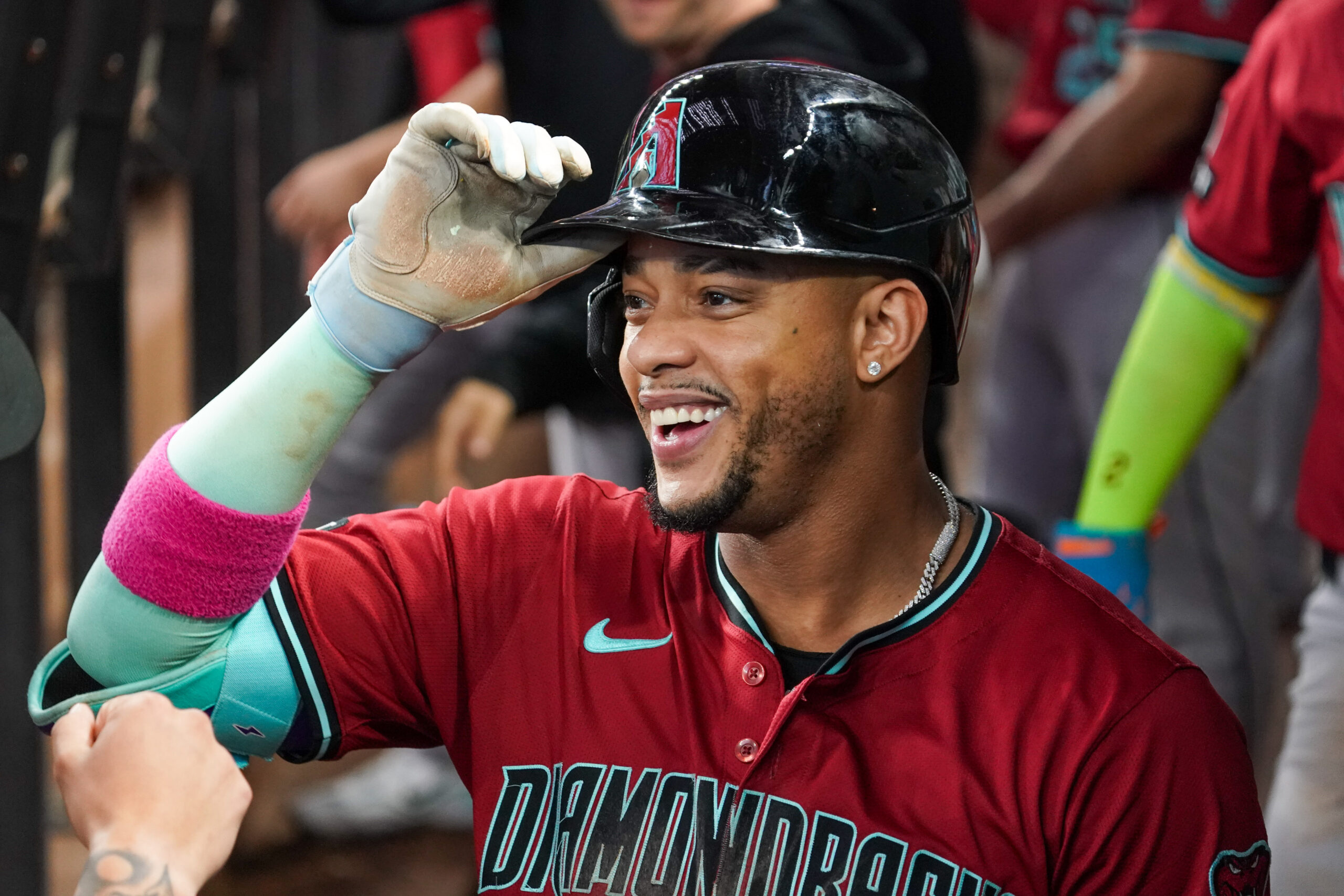 Aug 13, 2025; Arlington, Texas, USA; Arizona Diamondbacks second baseman Ketel Marte (4) is greeted in the dugout after hitting a three-run home run during the ninth inning against the Texas Rangers at Globe Life Field. Mandatory Credit: Raymond Carlin III-Imagn Images