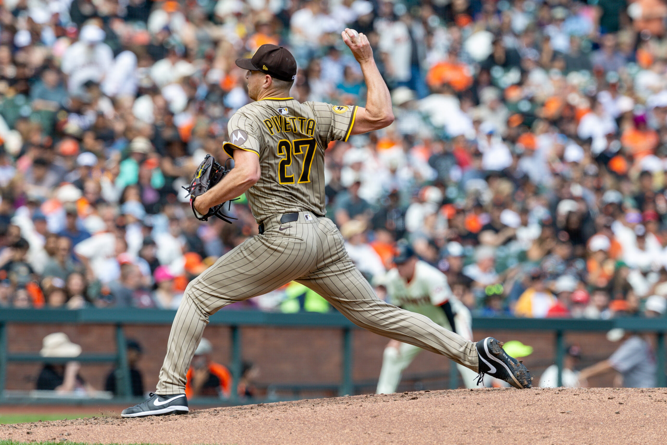 Aug 13, 2025; San Francisco, California, USA; San Diego Padres pitcher Nick Pivetta (27) throws a pitch during the fourth inning against the San Francisco Giants at Oracle Park. Mandatory Credit: Bob Kupbens-Imagn Images