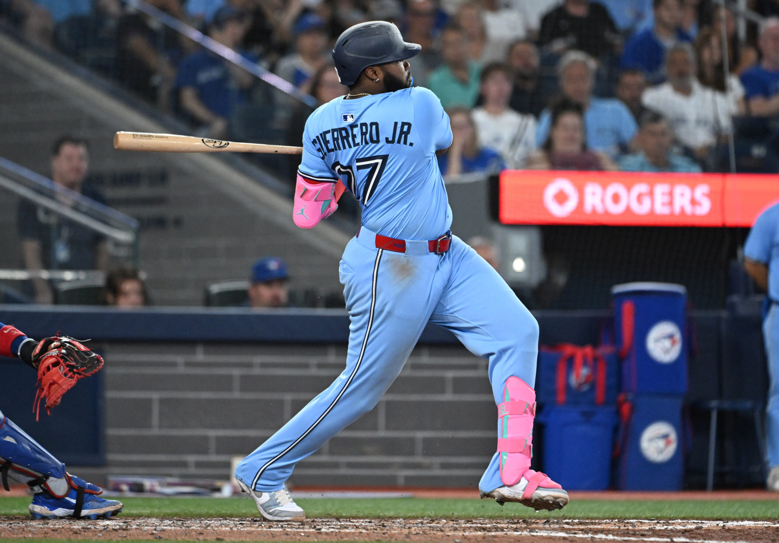 Aug 13, 2025; Toronto, Ontario, CAN;   Toronto Blue Jays first baseman Vladimir Guerrero Jr. (27) hits an RBI double against the Chicago Cubs in the sixth inning at Rogers Centre. Mandatory Credit: Dan Hamilton-Imagn Images